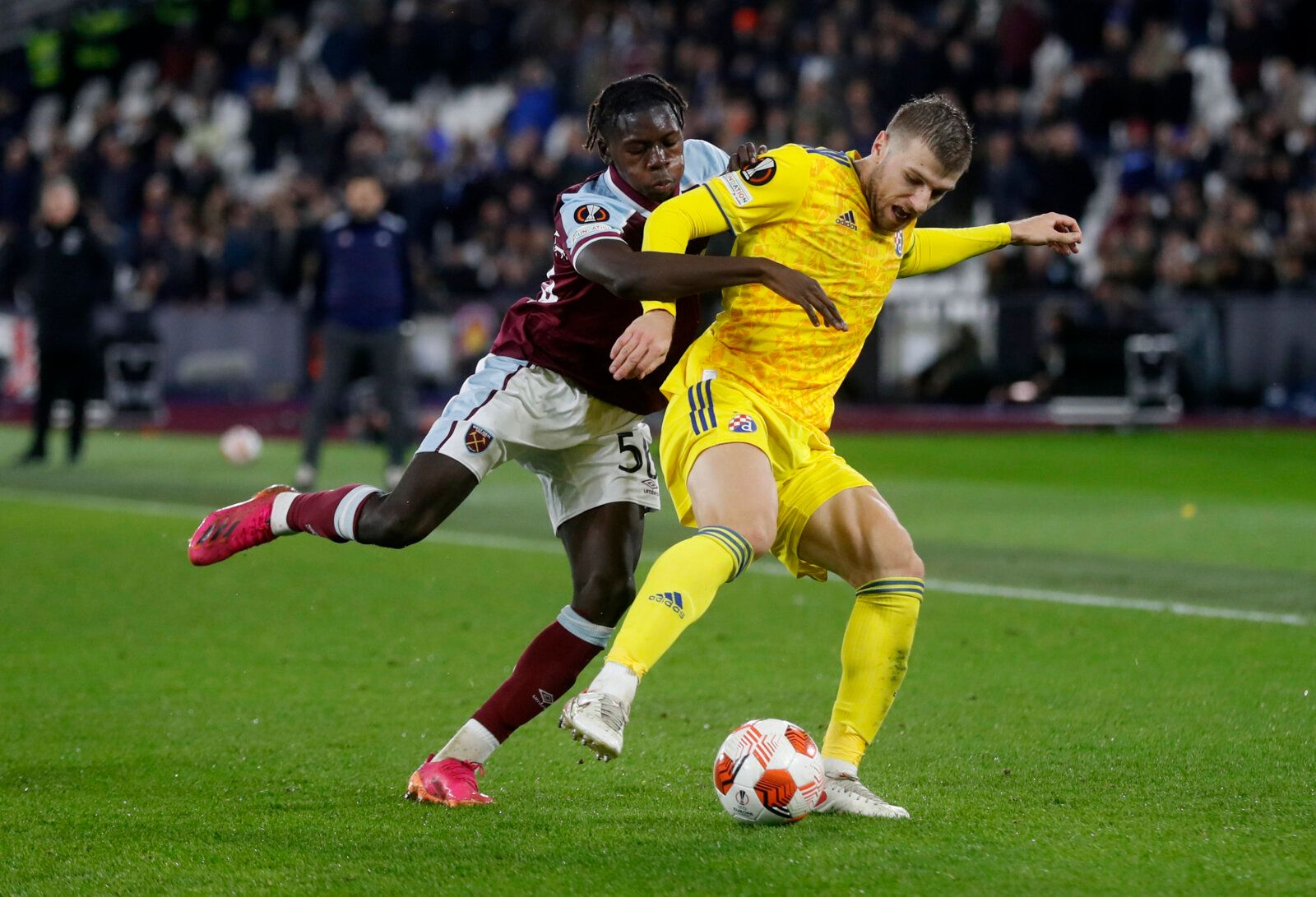 Soccer Football - Europa League - Group H - West Ham United v Dinamo Zagreb - London Stadium, London, Britain - December 9, 2021  Dinamo Zagreb's Stefan Ristovski in action with West Ham United's Manny Longelo Action Images via Reuters/Matthew Childs