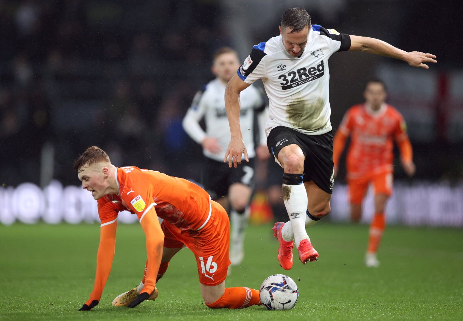 Soccer Football - Championship - Derby County v Blackpool - Pride Park, Derby, Britain - December 11, 2021  Blackpool's Sonny Carey in action with Derby County's Phil Jagielka   Action Images/Molly Darlington  EDITORIAL USE ONLY. No use with unauthorized audio, video, data, fixture lists, club/league logos or 