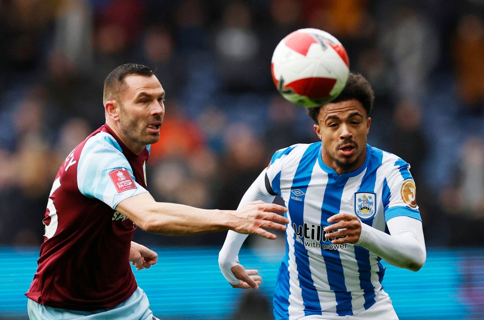 Soccer Football - FA Cup Third Round - Burnley v Huddersfield Town - Turf Moor, Burnley, Britain - January 8, 2022 Burnley's Phil Bardsley in action with Huddersfield Town's Josh Koroma Action Images via Reuters/Jason Cairnduff