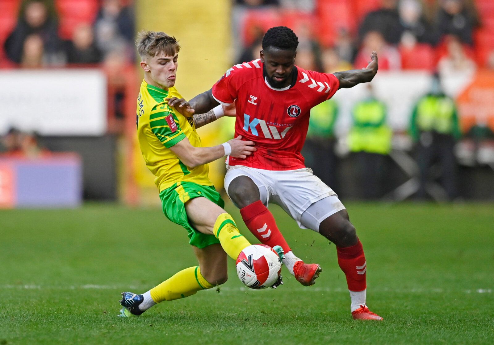 Soccer Football - FA Cup Third Round - Charlton Athletic v Norwich City - The Valley, London, Britain - January 9, 2022 Charlton Athletic's Diallang Jaiyesimi in action with Norwich City's Brandon Williams REUTERS/Tony Obrien