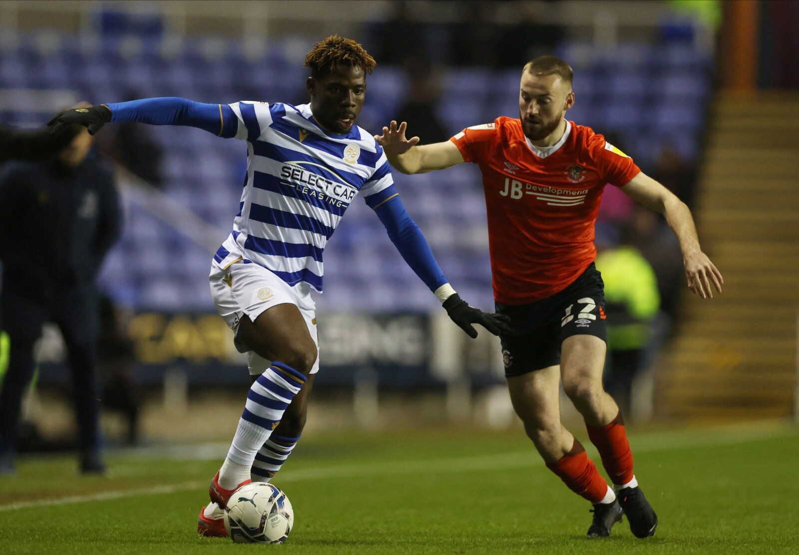 Soccer Football - Championship - Reading v Luton Town - Madejski Stadium, Reading, Britain - January 19, 2022  Reading's Tom Dele-Bashiru in action with Luton Town's Allan Campbell  Action Images/Paul Childs  EDITORIAL USE ONLY. No use with unauthorized audio, video, data, fixture lists, club/league logos or 