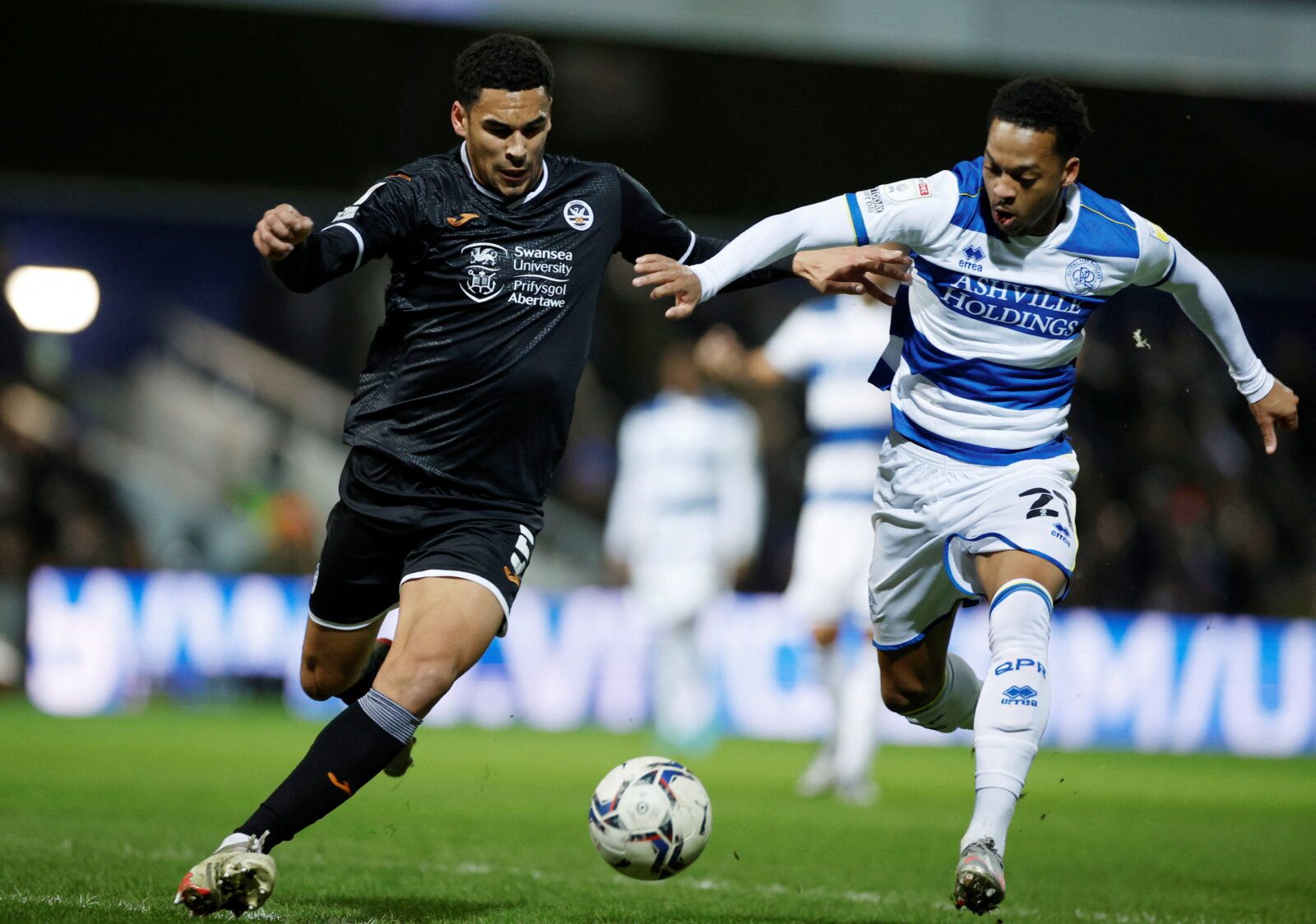 Soccer Football - Championship - Queens Park Rangers v Swansea City - Loftus Road, London, Britain - January 25, 2022 Swansea City's Ben Cabango in action with Queens Park Rangers' Chris Willock  Action Images/John Sibley  EDITORIAL USE ONLY. No use with unauthorized audio, video, data, fixture lists, club/league logos or "live" services. Online in-match use limited to 75 images, no video emulation. No use in betting, games or single club/league/player publications.  Please contact your account 