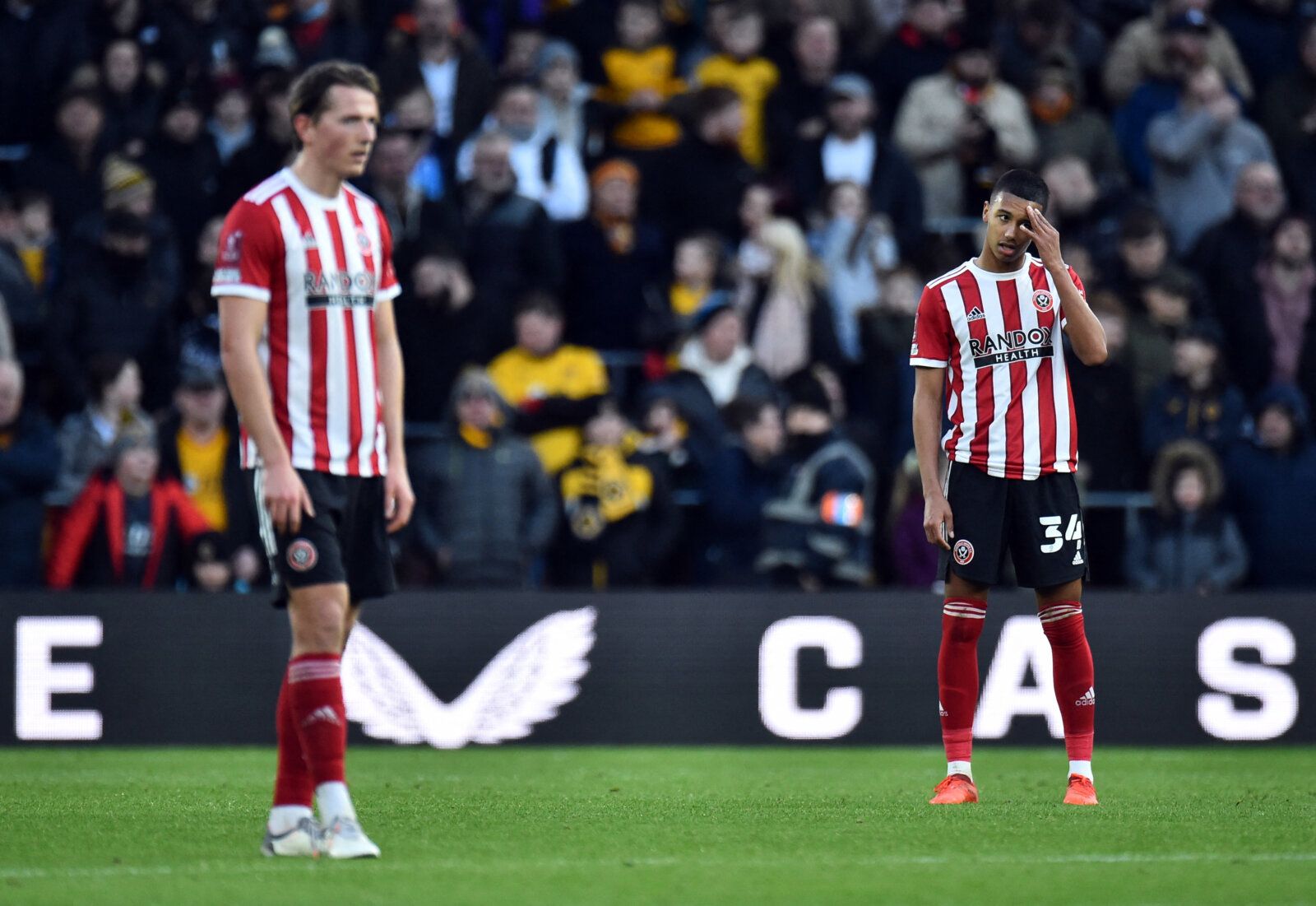 Soccer Football - FA Cup Third Round - Wolverhampton Wanderers v Sheffield United - Molineux Stadium, Wolverhampton, Britain - January 9, 2022 Sheffield United's Kyron Gordon looks dejected after Wolverhampton Wanderers' Nelson Semedo scores their second goal REUTERS/Peter Powell
