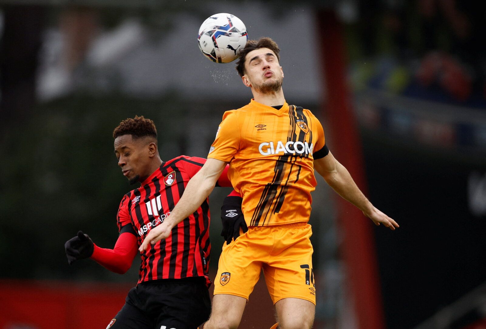 Soccer Football - Championship - AFC Bournemouth v Hull City - Vitality Stadium, Bournemouth, Britain - January 22, 2022 Bournemouth's Jamal Lowe in action with Hull City's Ryan Longman  Action Images/John Sibley  EDITORIAL USE ONLY. No use with unauthorized audio, video, data, fixture lists, club/league logos or 