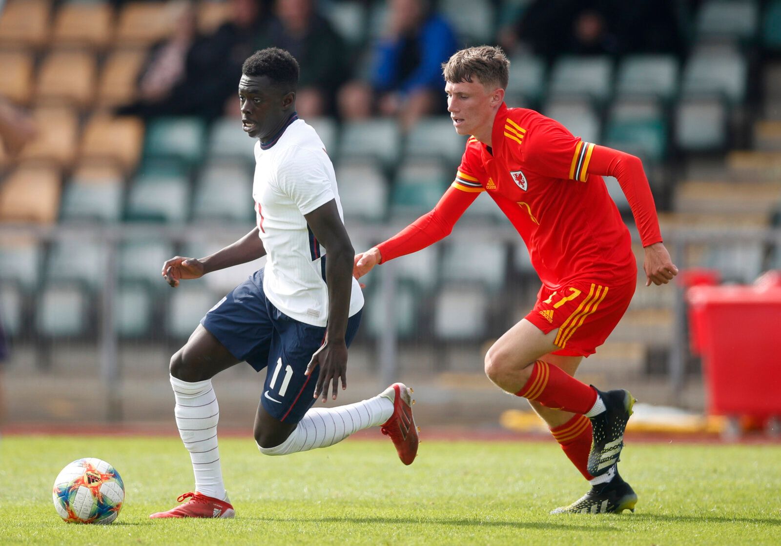 Soccer Football - Under 18 International Friendly - Wales v England - Spytty Park, Newport, Wales Britain - September 3, 2021 Wales’ Harry Jewitt White in action with England's Michael Olakigbe Action Images/Matthew Childs