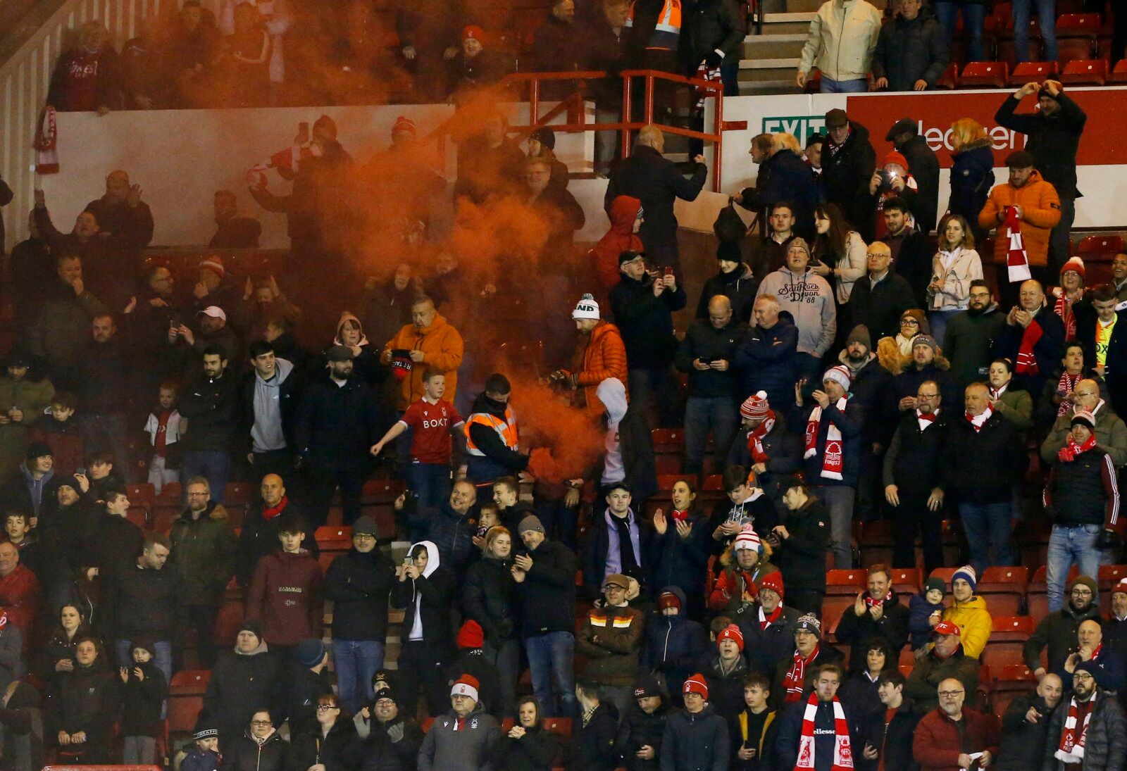 Soccer Football - FA Cup Third Round - Nottingham Forest v Arsenal - The City Ground, Nottingham, Britain - January 9, 2022 Fans with a flare are pictured in the stands REUTERS/Craig Brough