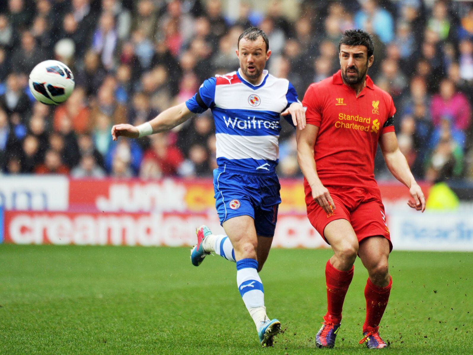 Football - Reading v Liverpool - Barclays Premier League  - The Madejski Stadium - 13/4/13 
Reading's Noel Hunt (L) in action with Liverpool's Jose Enrique 
Mandatory Credit: Action Images / Adam Holt 
Livepic 
EDITORIAL USE ONLY. No use with unauthorized audio, video, data, fixture lists, club/league logos or live services. Online in-match use limited to 45 images, no video emulation. No use in betting, games or single club/league/player publications.  Please contact your account representative