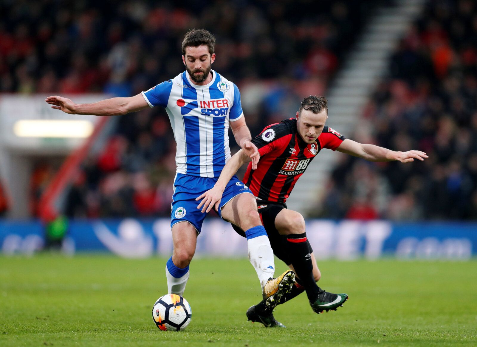 Soccer Football - FA Cup Third Round - AFC Bournemouth vs Wigan Athletic - Vitality Stadium, Bournemouth, Britain - January 6, 2018   Wigan Athletic’s Will Grigg in action with Bournemouth's Brad Smith    Action Images via Reuters/Matthew Childs