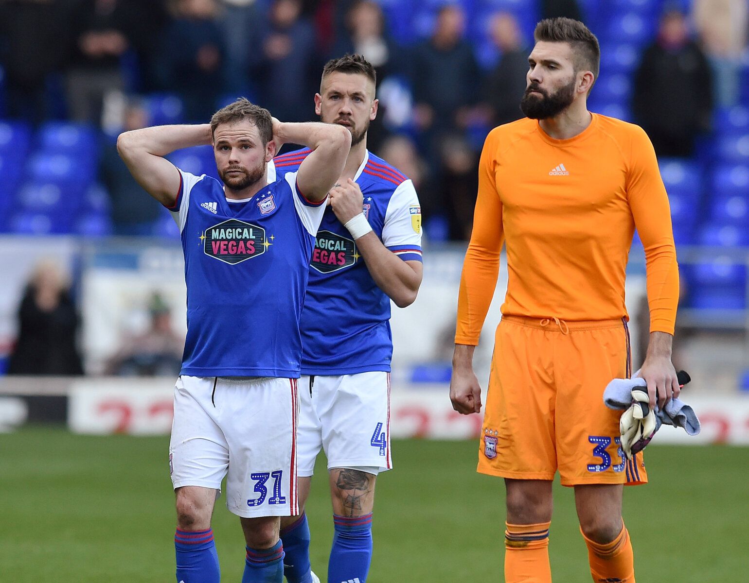 Soccer Football - Championship - Ipswich Town v Birmingham City - Portman Road, Ipswich, Britain - April 13, 2019   Ipswich Town's Alan Judge, Luke Chambers and Bartosz Bialkowski look dejected at the end of the match as they are relegated to League One   Action Images/Alan Walter    EDITORIAL USE ONLY. No use with unauthorized audio, video, data, fixture lists, club/league logos or 