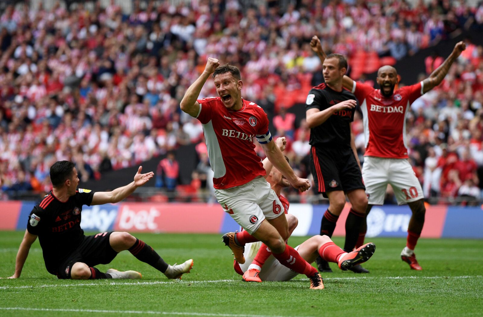 Soccer Football - League One Playoff Final - Sunderland v Charlton Athletic - Wembley Stadium, London, Britain - May 26, 2019  Charlton Athletic's Jason Pearce celebrates their second goal scored by Patrick Bauer   Action Images/Tony O'Brien  EDITORIAL USE ONLY. No use with unauthorized audio, video, data, fixture lists, club/league logos or 