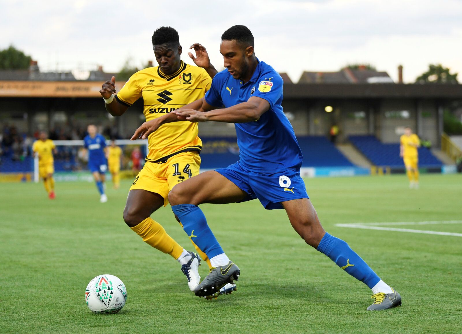 Soccer Football - Carabao Cup First Round - AFC Wimbledon v Milton Keynes Dons - Kingsmeadow, London, Britain - August 13, 2019  AFC Wimbledon's Terrell Thomas in action with MK Dons' Kieran Agard   Action Images/Tony O'Brien  EDITORIAL USE ONLY. No use with unauthorized audio, video, data, fixture lists, club/league logos or 