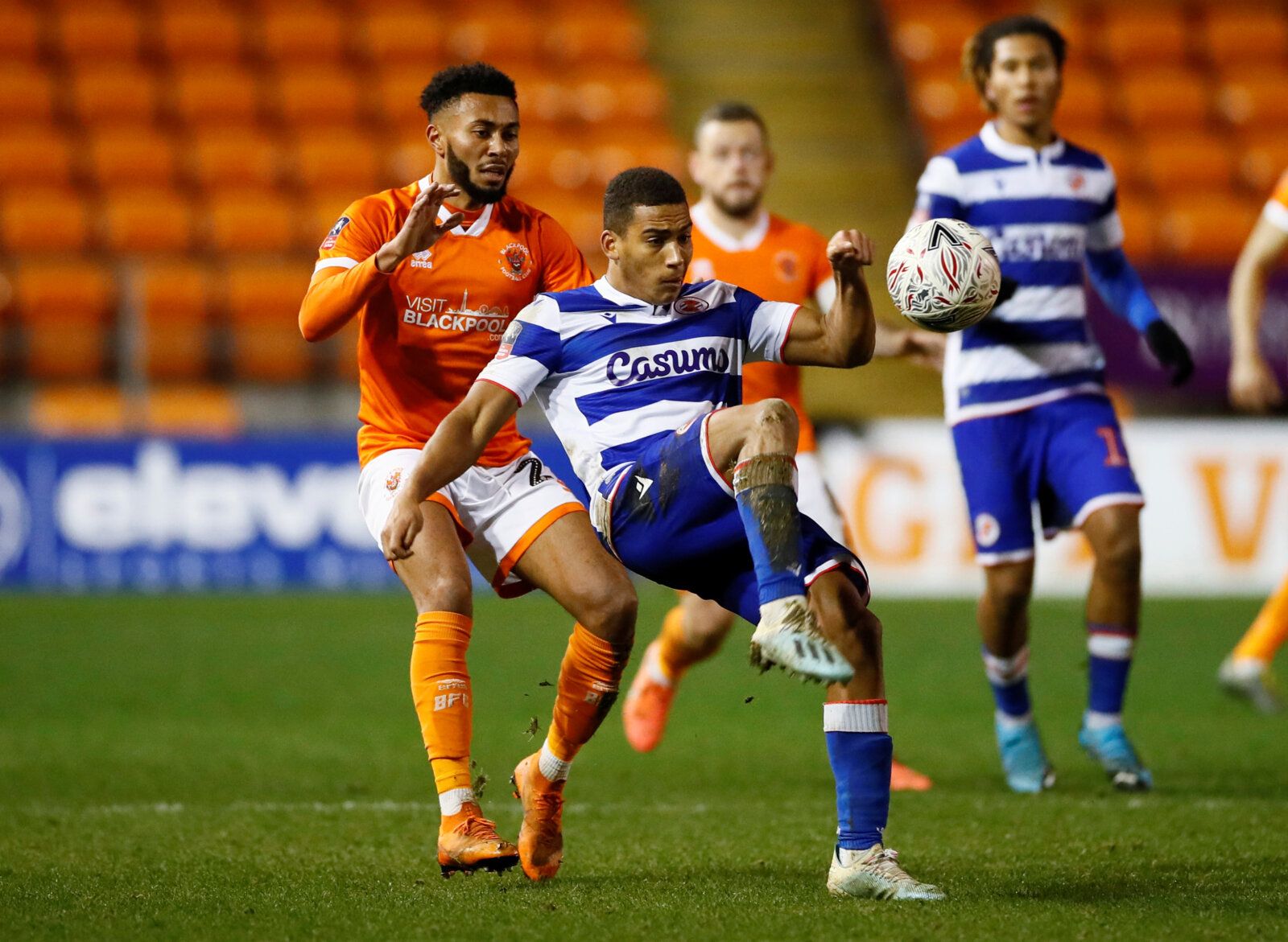 Soccer Football - FA Cup Third Round Replay - Blackpool v Reading - Bloomfield Road, Blackpool, Britain - January 14, 2020  Blackpool's Grant Ward in action with Reading's Andy Rinomhota         Action Images/Jason Cairnduff