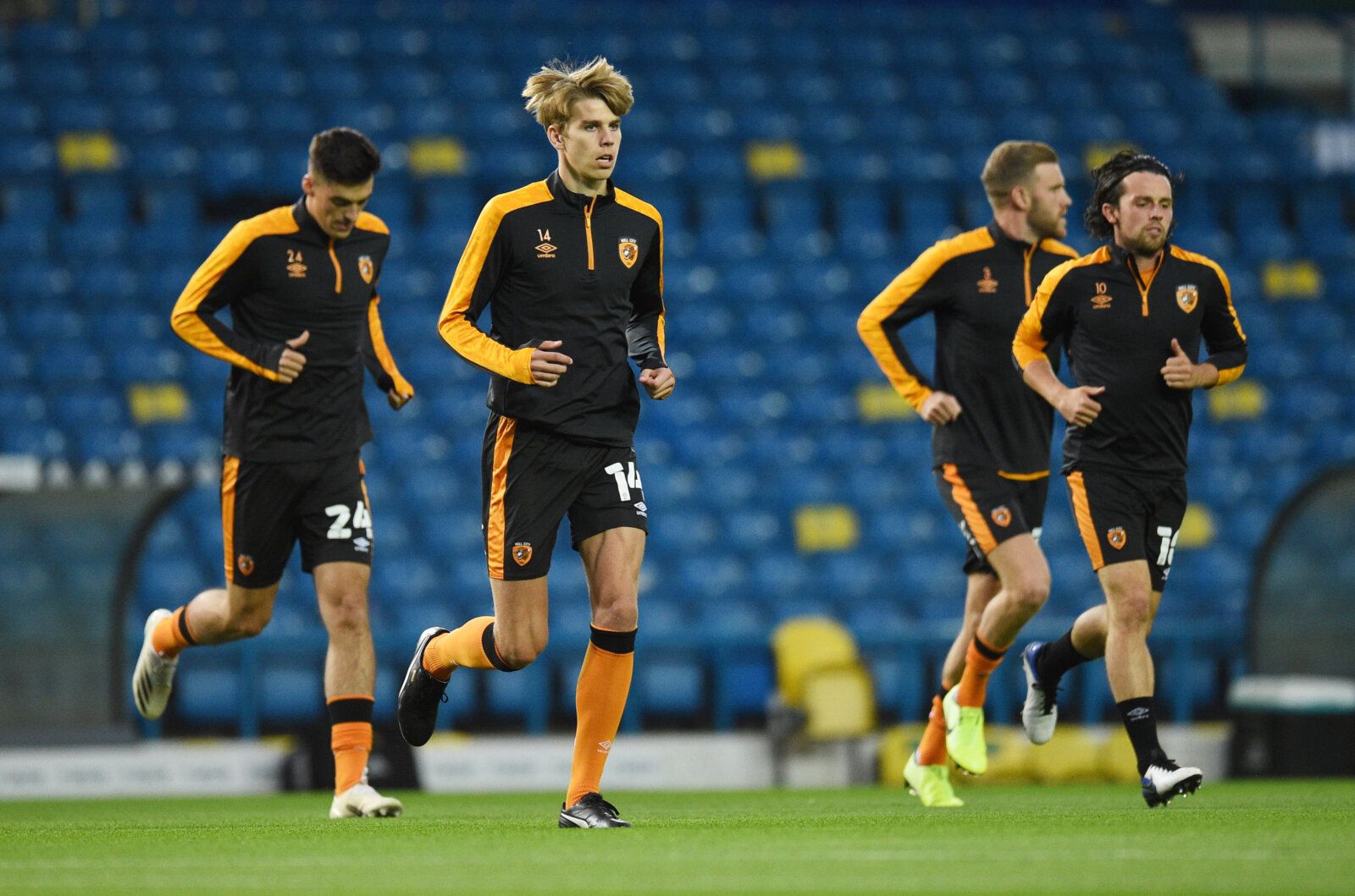 Soccer Football - Carabao Cup Second Round - Leeds United v Hull City - Elland Road, Leeds, Britain - September 16, 2020 Hull City's Martin Samuelsen with George Honeyman and teammates during the warm up before the match Pool via REUTERS/Oli Scarff EDITORIAL USE ONLY. No use with unauthorized audio, video, data, fixture lists, club/league logos or 'live' services. Online in-match use limited to 75 images, no video emulation. No use in betting, games or single club/league/player publications.  Pl