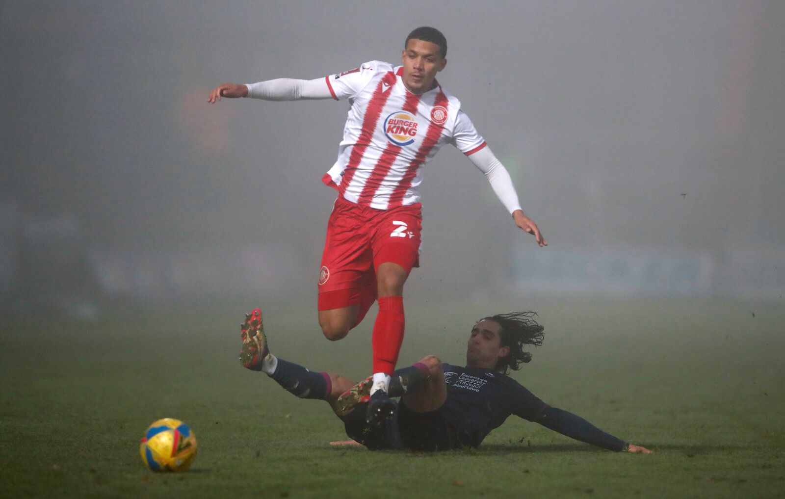 Soccer Football - FA Cup - Third Round - Stevenage v Swansea City - The Lamex Stadium, Stevenage, Britain - January 9, 2021 Stevenage's Luther Wildin in action with Swansea City's Yan Dhanda Action Images via Reuters/Andrew Couldridge