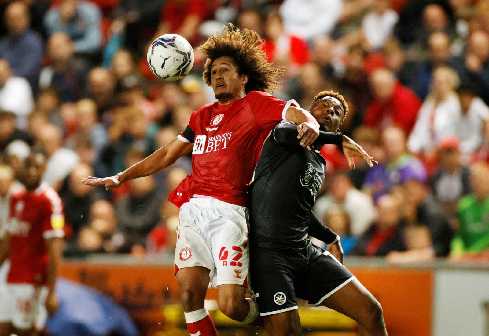 Soccer Football - Championship - Bristol City v Swansea City - Ashton Gate Stadium, Bristol, Britain - August 20, 2021  Bristol City's Han-Noah Massengo in action with Swansea City's Jamal Lowe  Action Images/John Sibley  EDITORIAL USE ONLY. No use with unauthorized audio, video, data, fixture lists, club/league logos or "live" services. Online in-match use limited to 75 images, no video emulation. No use in betting, games or single club/league/player publications.  Please contact your account r