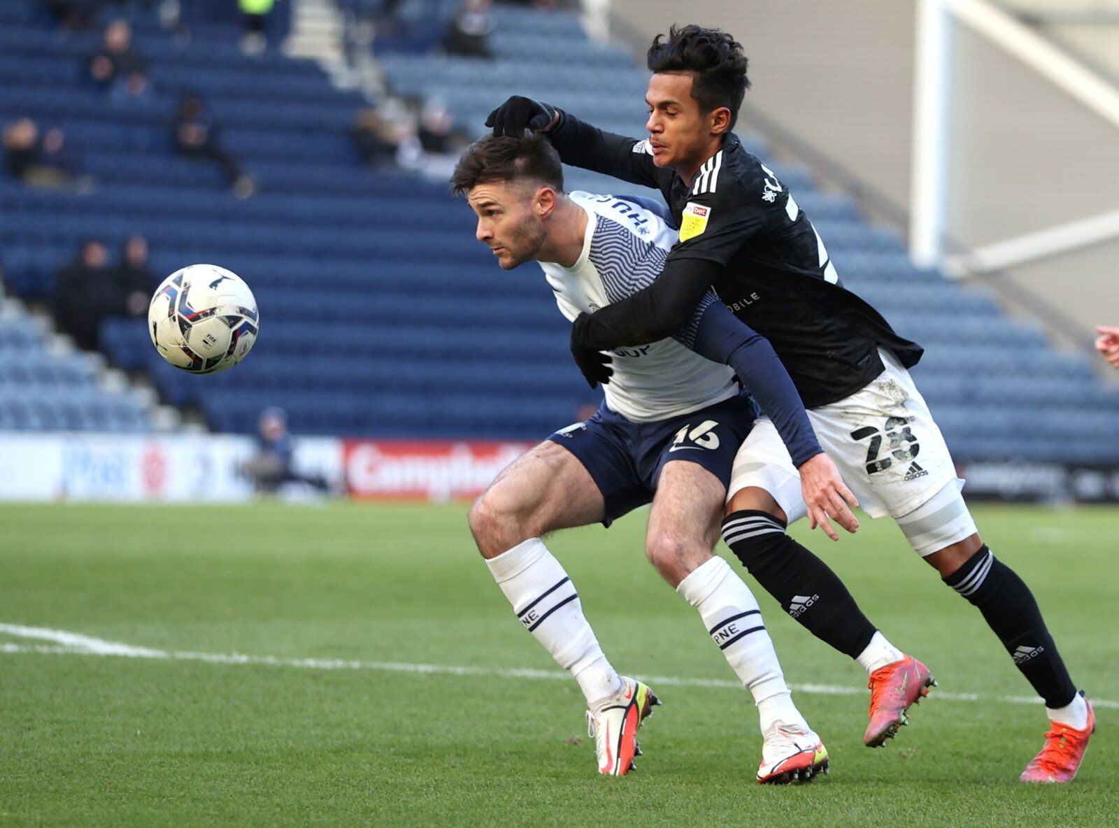 Soccer Football - Championship - Preston North End v Fulham - Deepdale, Preston, Britain - November 27, 2021 Preston North End's Andrew Hughes in action with Fulham's Fabio Carvalho Action Images/Molly Darlington