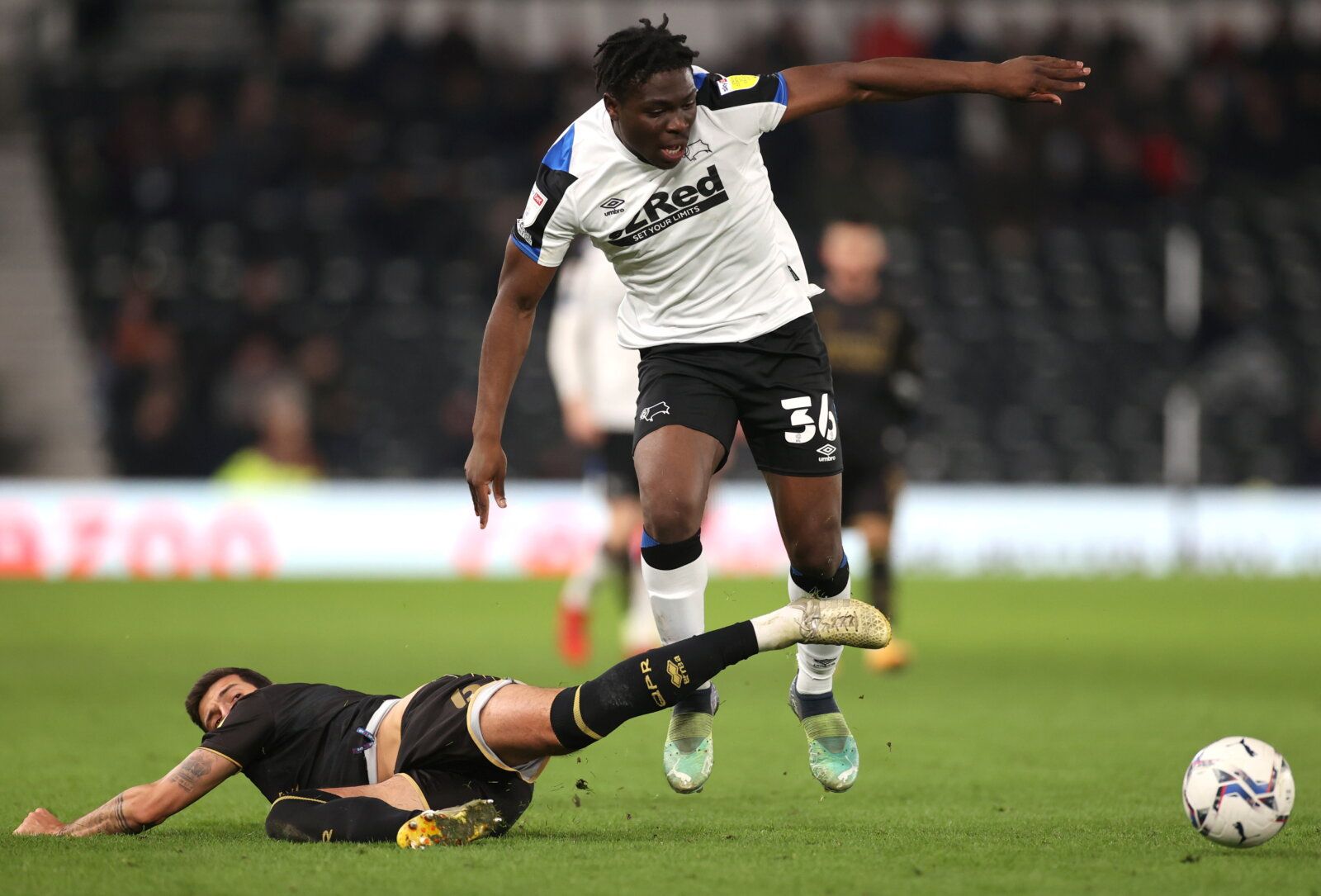 Soccer Football - Championship - Derby County v Queens Park Rangers - Pride Park, Derby, Britain - November 29, 2021 Derby County?s Festy Ebosele in action with Queens Park Rangers' Yoann Barbet Action Images/Carl Recine