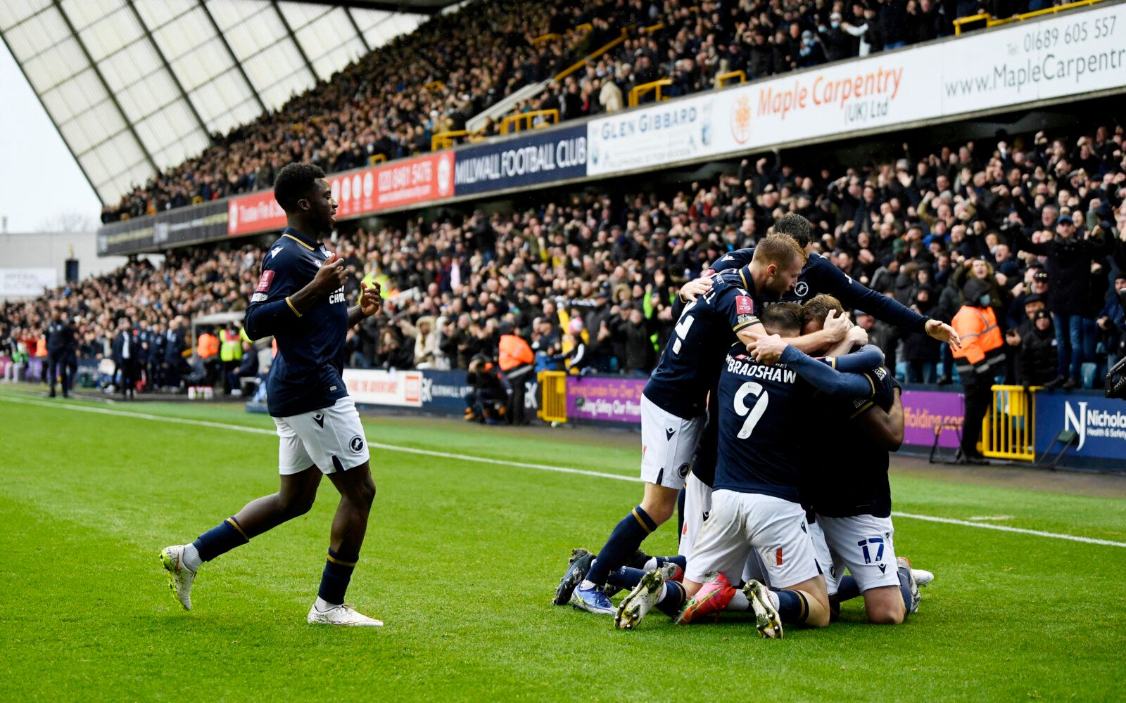 Soccer Football - FA Cup Third Round - Millwall v Crystal Palace - The Den, London, Britain - January 8, 2022 Millwall's Benik Afobe celebrates scoring their first goal with teammates REUTERS/Tony Obrien