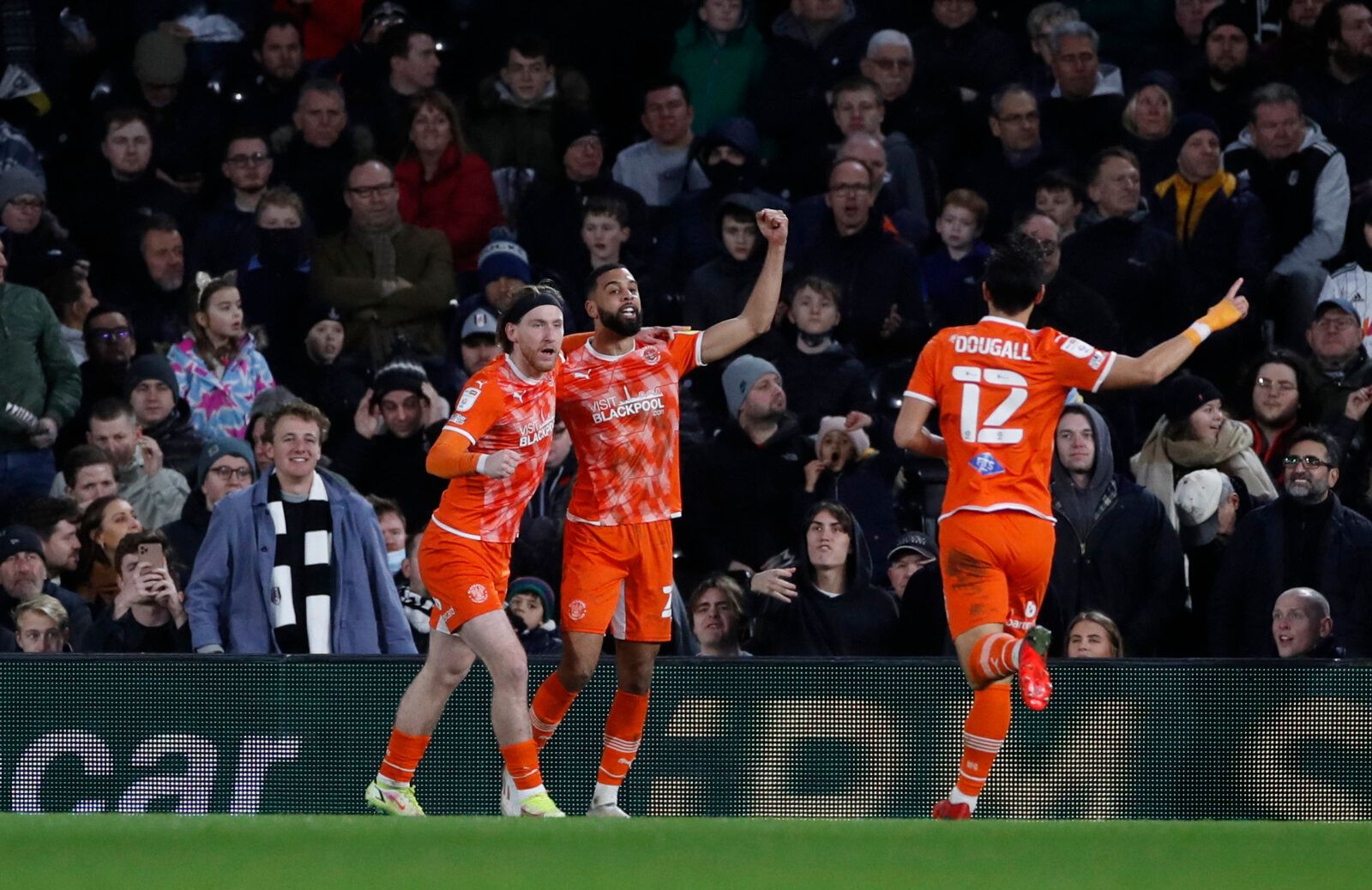 Soccer Football - Championship - Fulham v Blackpool - Craven Cottage, London, Britain - January 29, 2022 Blackpool's Josh Bowler celebrates scoring their first goal with Christopher Hamilton Action Images/Paul Childs EDITORIAL USE ONLY. No use with unauthorized audio, video, data, fixture lists, club/league logos or 'live' services. Online in-match use limited to 75 images, no video emulation. No use in betting, games or single club /league/player publications.  Please contact your account repre