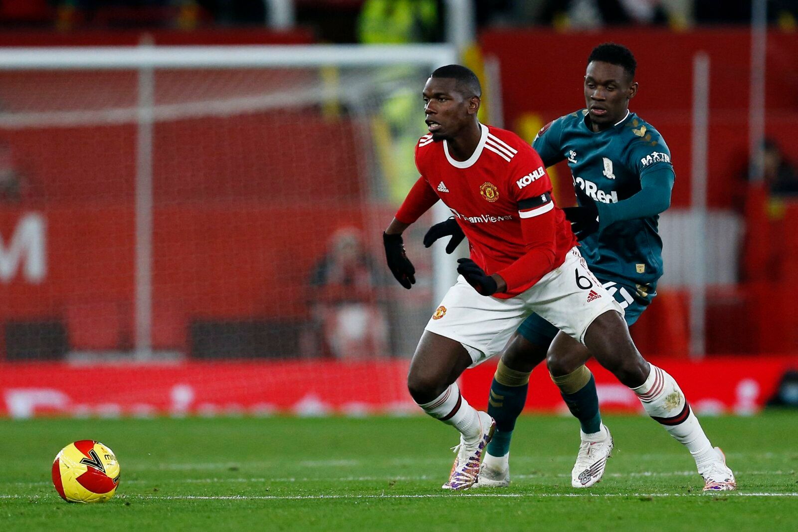 Soccer Football - FA Cup Fourth Round - Manchester United v Middlesbrough - Old Trafford, Manchester, Britain - February 4, 2022 Manchester United's Paul Pogba in action with Middlesbrough's Folarin Balogun REUTERS/Craig Brough