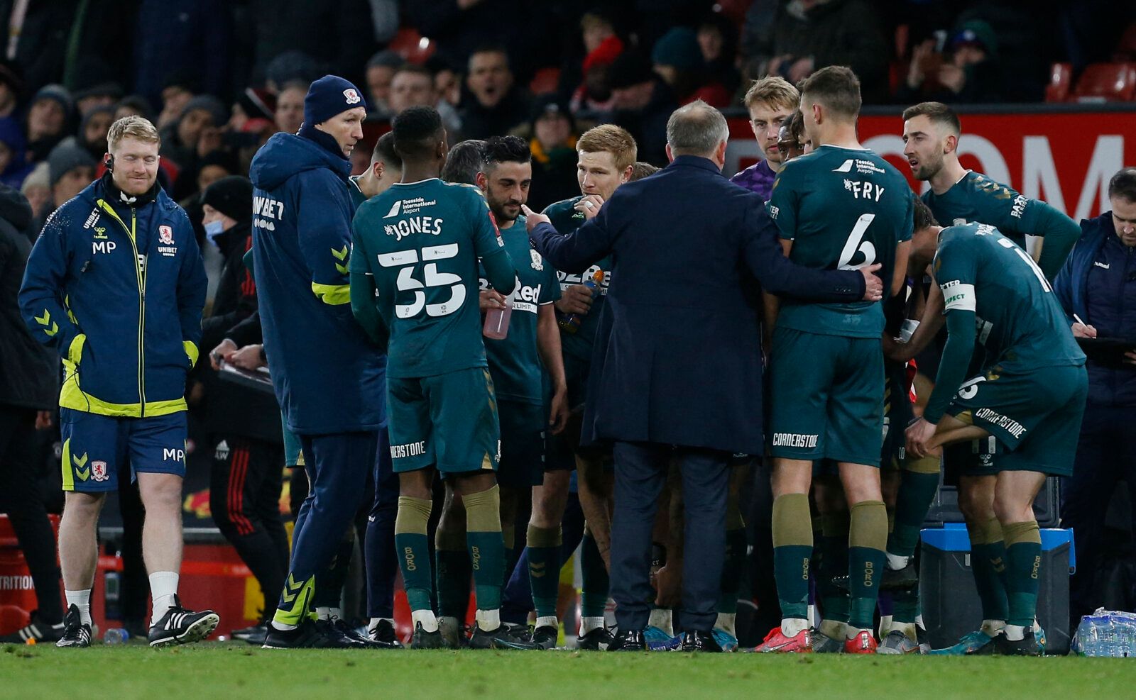 Soccer Football - FA Cup Fourth Round - Manchester United v Middlesbrough - Old Trafford, Manchester, Britain - February 4, 2022 Middlesbrough manager Chris Wilder talks to his players before the start of extra time REUTERS/Craig Brough