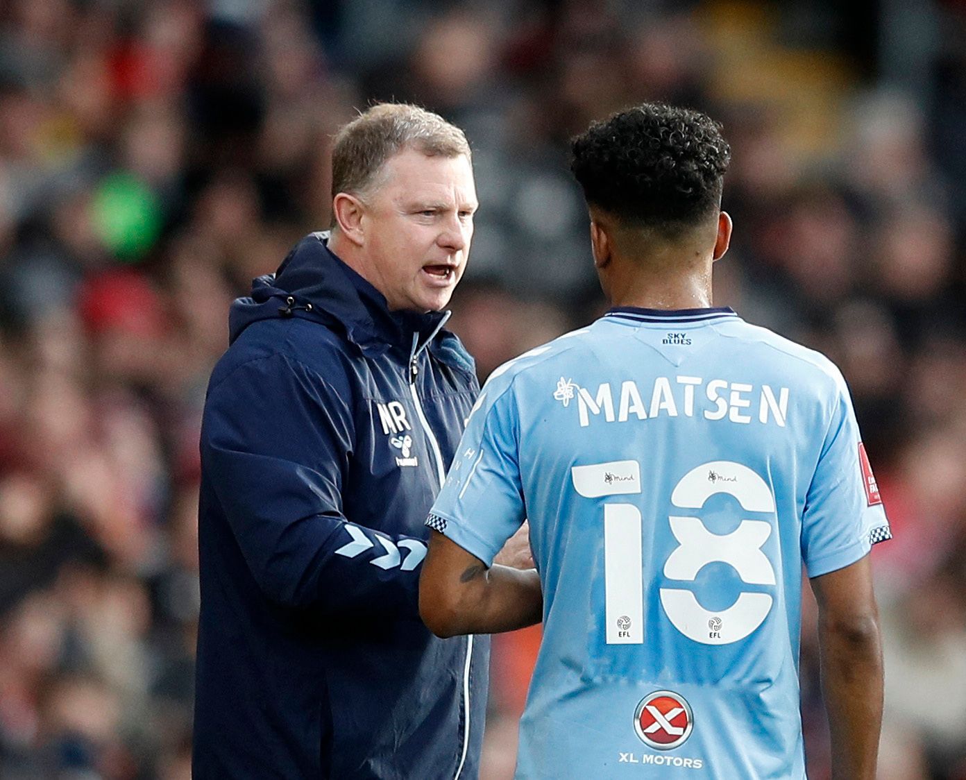 Soccer Football - FA Cup - Fourth Round - Southampton v Coventry City - St Mary's Stadium, Southampton, Britain - February 5, 2022 Coventry City manager Mark Robins talks to Ian Maatsen REUTERS/Peter Nicholls