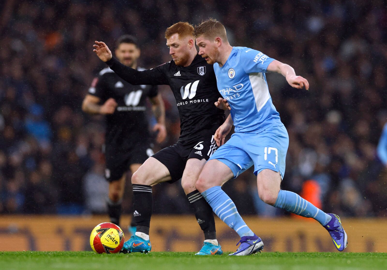 Soccer Football - FA Cup - Fourth Round - Manchester City v Fulham - Etihad Stadium, Manchester, Britain - February 5, 2022 Manchester City's Kevin De Bruyne in action with Fulham's Harrison Reed Action Images via Reuters/Jason Cairnduff