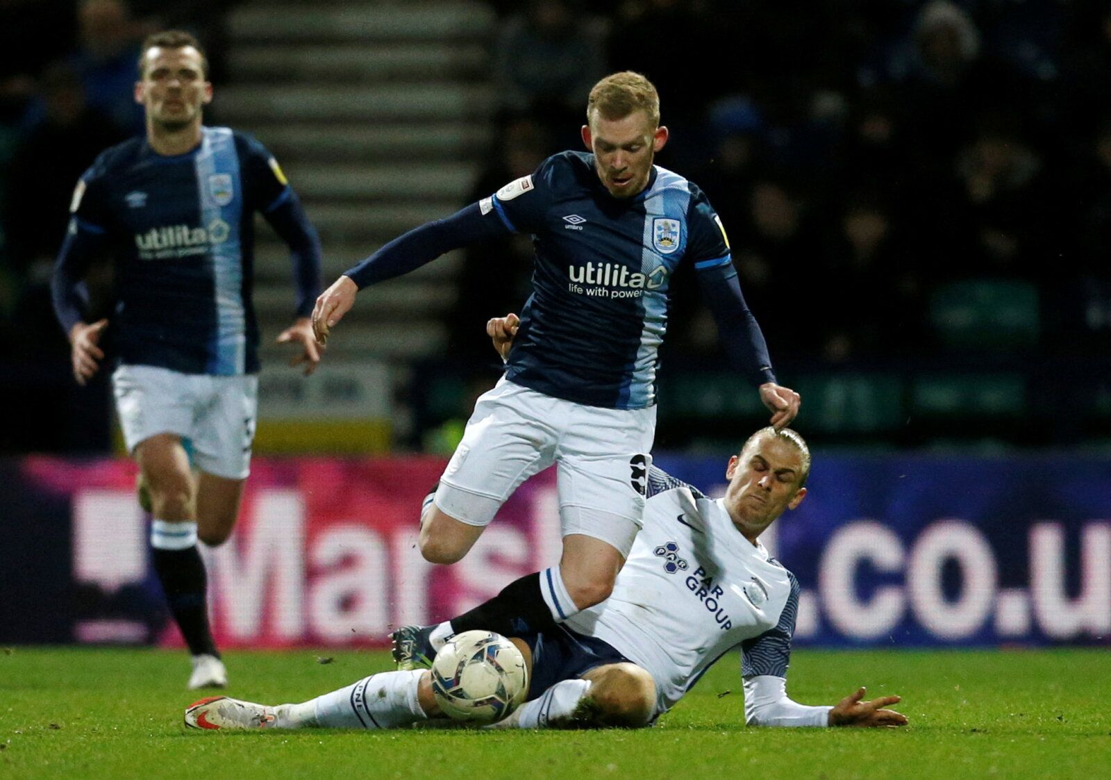 Soccer Football - Championship - Preston North End v Huddersfield Town - Deepdale, Preston, Britain - February 9, 2022  Huddersfield Town's Lewis O'Brien in action with Preston North End's Brad Potts  Action Images/Ed Sykes  EDITORIAL USE ONLY. No use with unauthorized audio, video, data, fixture lists, club/league logos or 