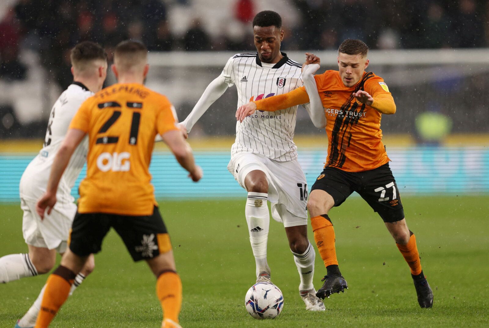 Soccer Football - Championship - Hull City v Fulham - KCOM Stadium, Hull, Britain - February 12, 2022  Fulham's Tosin Adarabioyo in action with Hull City's Regan Slater  Action Images/John Clifton  EDITORIAL USE ONLY. No use with unauthorized audio, video, data, fixture lists, club/league logos or 