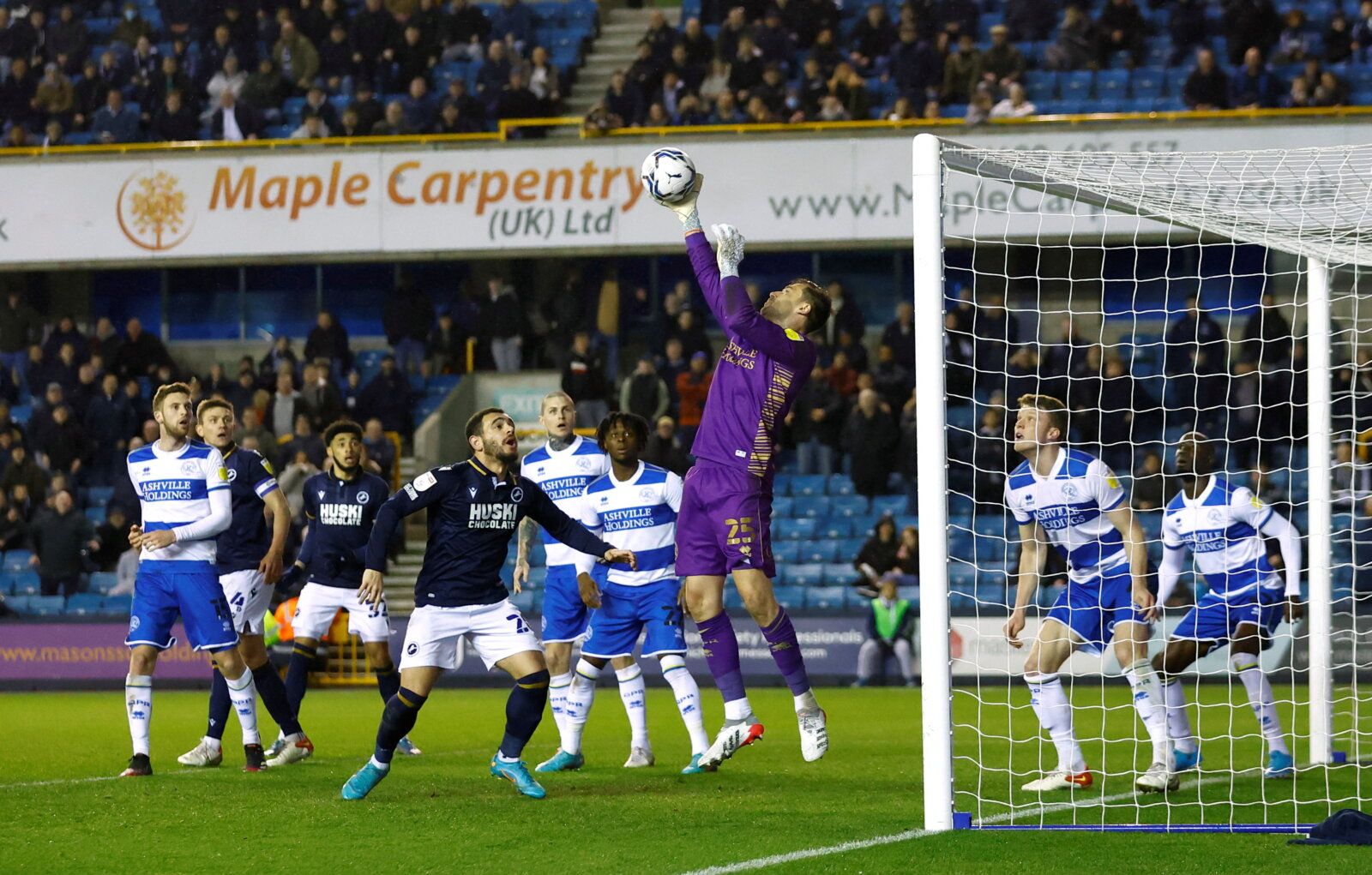 Soccer Football - Championship - Millwall v Queens Park Rangers - The Den, London, Britain - February 15, 2022 Queens Park Rangers' David Marshall saves a shot from Millwall's Jake Cooper Action Images/Andrew Boyers  EDITORIAL USE ONLY. No use with unauthorized audio, video, data, fixture lists, club/league logos or 