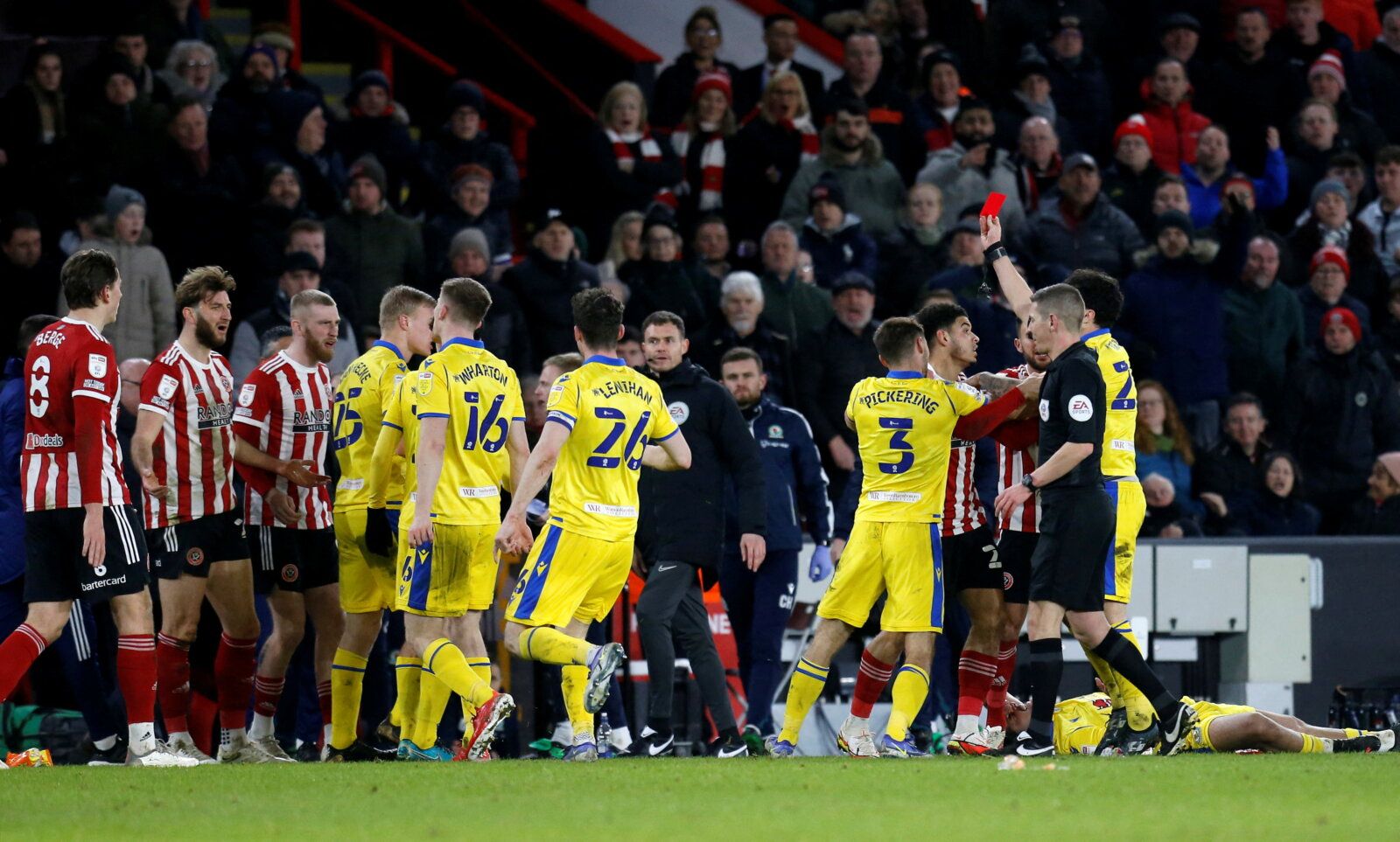 Soccer Football - Championship - Sheffield United v Blackburn Rovers - Bramall Lane, Sheffield, Britain - February 23, 2022  Sheffield United's Charlie Goode is shown a red card by referee Matt Donohue Action Images/Ed Sykes