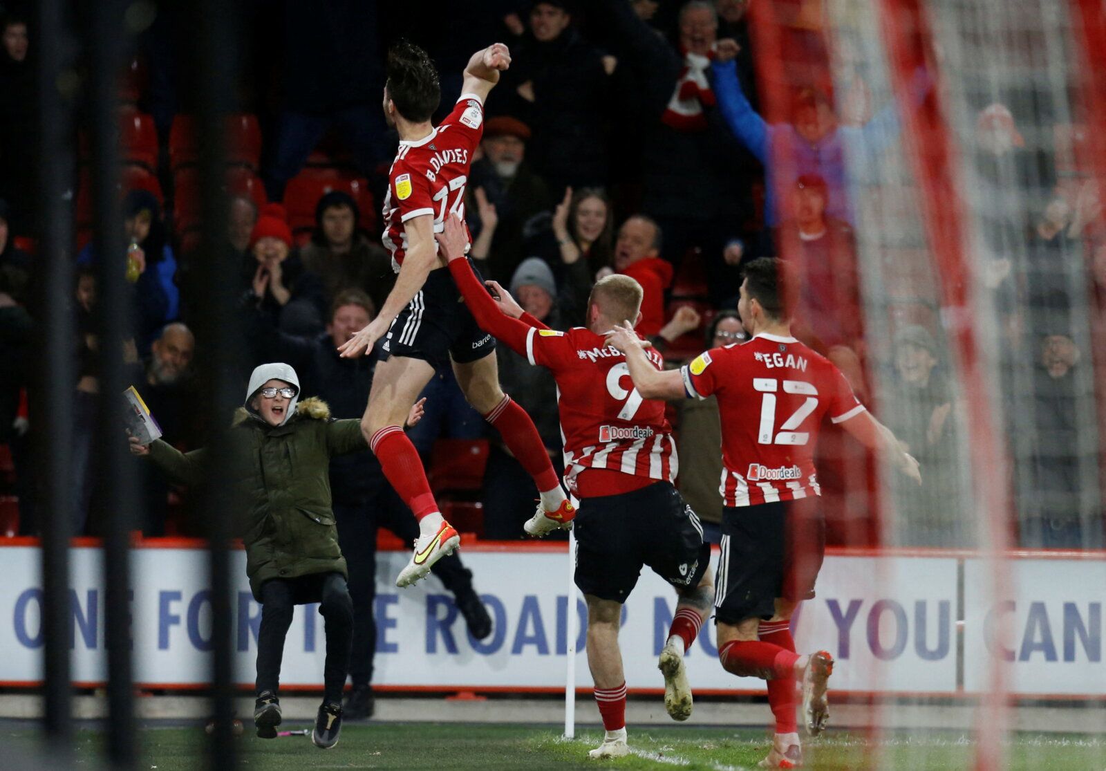 Soccer Football - Championship - Sheffield United v Blackburn Rovers - Bramall Lane, Sheffield, Britain - February 23, 2022  Sheffield United's Ben Davies celebrates scoring their first goal with teammates Action Images/Ed Sykes