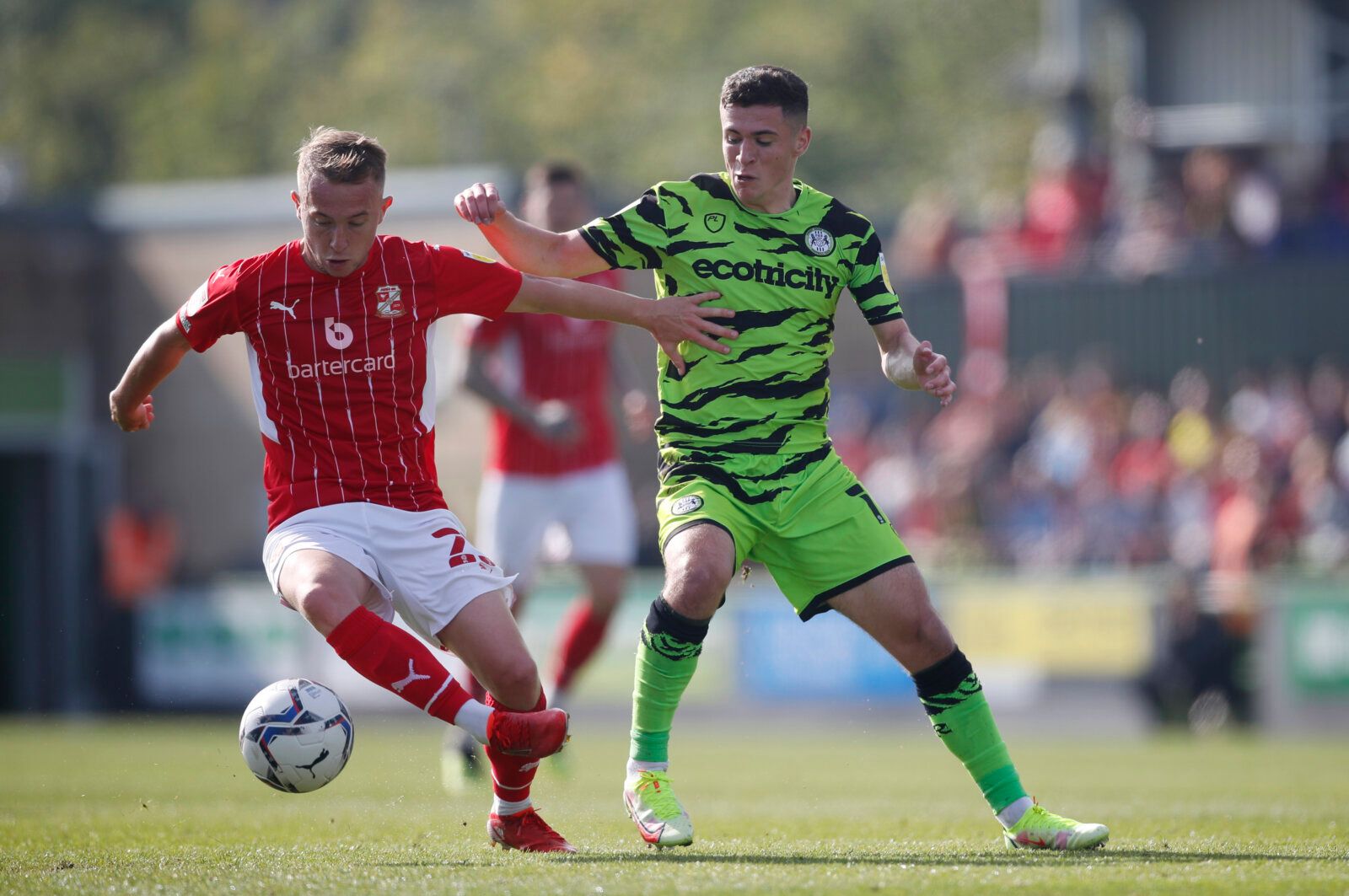 Soccer Football - League Two - Forest Green Rovers v Swindon Town - The New Lawn Stadium, Nailsworth, Britain - October 9, 2021 Forest Green Rovers’ Jack Aitchison in action with Swindon Town’s Louis Reed Action Images/Matthew Childs EDITORIAL USE ONLY. No use with unauthorized audio, video, data, fixture lists, club/league logos or 'live' services. Online in-match use limited to 75 images, no video emulation. No use in betting, games or single club /league/player publications.  Please contact y