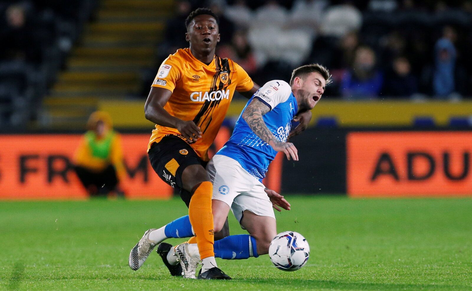 Soccer Football - Championship - Hull City v Peterborough United - KCOM Stadium, Hull, Britain - October 20, 2021  Hull City's Di'Shon Bernard (L) in action with Peterborough United's Sammie Szmodics  Action Images/Craig Brough  EDITORIAL USE ONLY. No use with unauthorized audio, video, data, fixture lists, club/league logos or 
