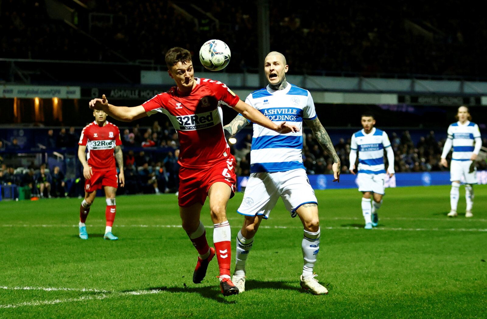 Soccer Football - Championship - Queens Park Rangers v Middlesbrough - Loftus Road, London, Britain - February 9, 2022  Middlesbrough's Dael Fry in action with Queens Park Rangers' Lyndon Dykes   Action Images/Andrew Boyers  EDITORIAL USE ONLY. No use with unauthorized audio, video, data, fixture lists, club/league logos or 