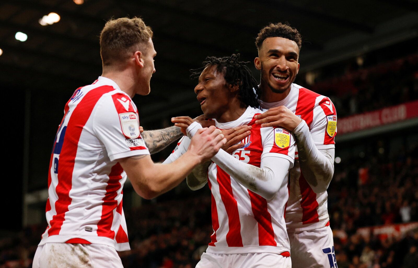 Soccer Football - Championship - Stoke City v Swansea City - bet365 Stadium, Stoke-on-Trent, Britain - February 8, 2022  Stoke City's Jaden Philogene-Bidace celebrates scoring their first goal with teammates   Action Images/Jason Cairnduff  EDITORIAL USE ONLY. No use with unauthorized audio, video, data, fixture lists, club/league logos or 
