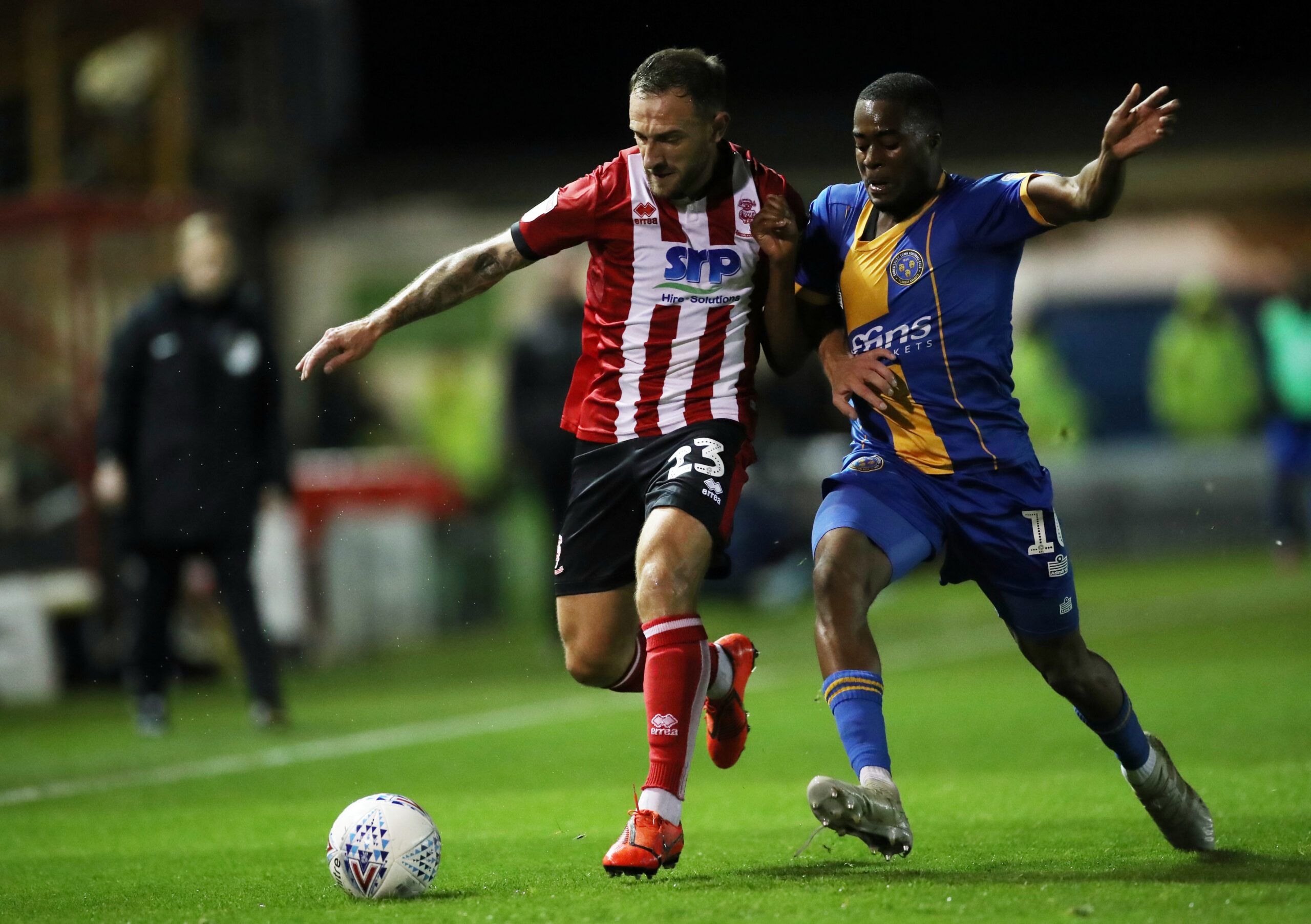 Soccer Football - League One - Lincoln City v Shrewsbury Town - Sincil Bank, Lincoln, Britain - October 18, 2019   Lincoln City's Neal Eardley in action with Shrewsbury Town's Fejiri Okenabirhie   Action Images/Carl Recine    EDITORIAL USE ONLY. No use with unauthorized audio, video, data, fixture lists, club/league logos or 