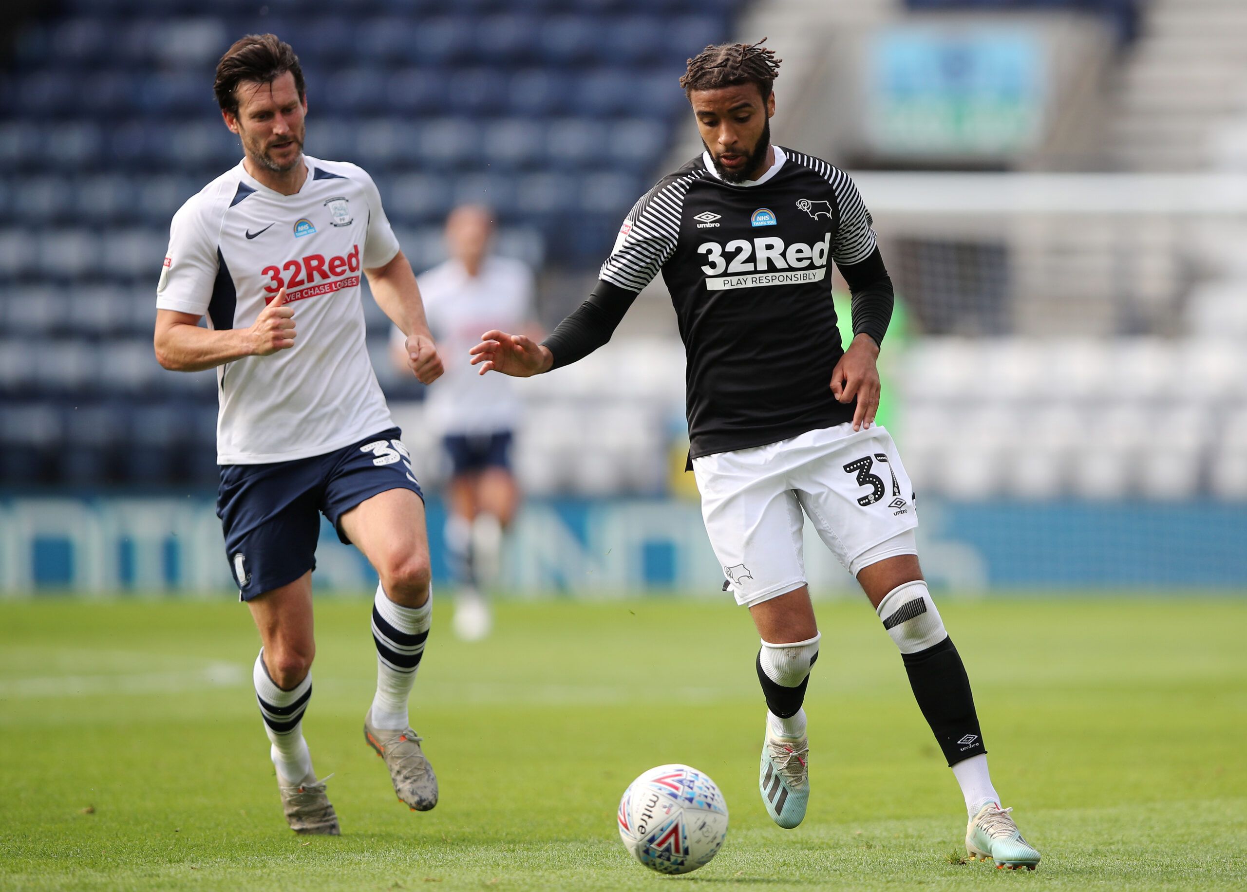 Soccer Football - Championship - Preston North End v Derby County - Deepdale, Preston, Britain - July 1, 2020   Derby County's Jayden Bogle in action with Preston North End's David Nugent, as play resumes behind closed doors following the outbreak of the coronavirus disease (COVID-19)   Action Images/Molly Darlington    EDITORIAL USE ONLY. No use with unauthorized audio, video, data, fixture lists, club/league logos or 