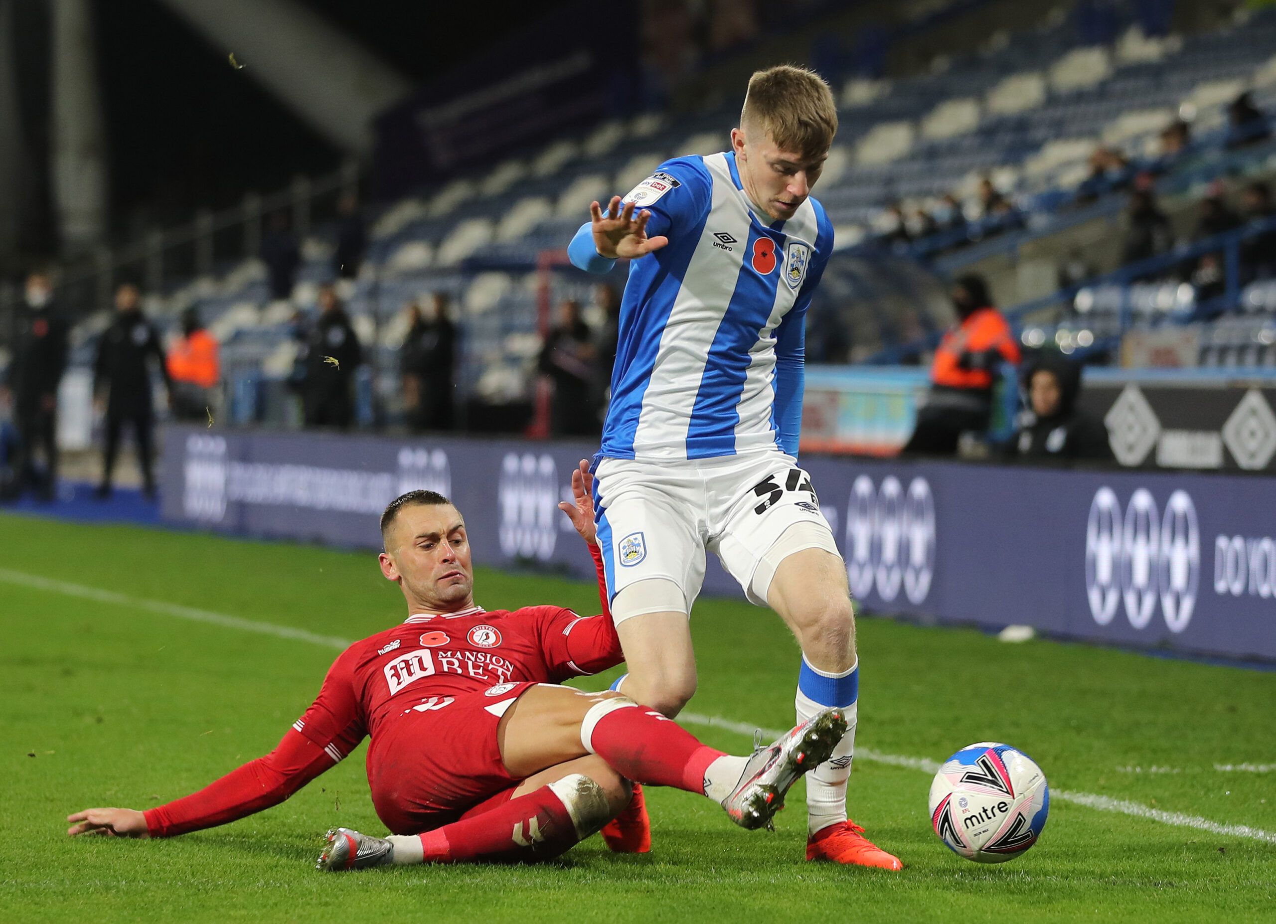 Soccer Football - Championship - Huddersfield Town v Bristol City - John Smith's Stadium, Huddersfield, Britain - November 3, 2020 Bristol City's Jack Hunt in action with Huddersfield Town's Matty Daly Action Images/Molly Darlington EDITORIAL USE ONLY. No use with unauthorized audio, video, data, fixture lists, club/league logos or 'live' services. Online in-match use limited to 75 images, no video emulation. No use in betting, games or single club /league/player publications.  Please contact yo