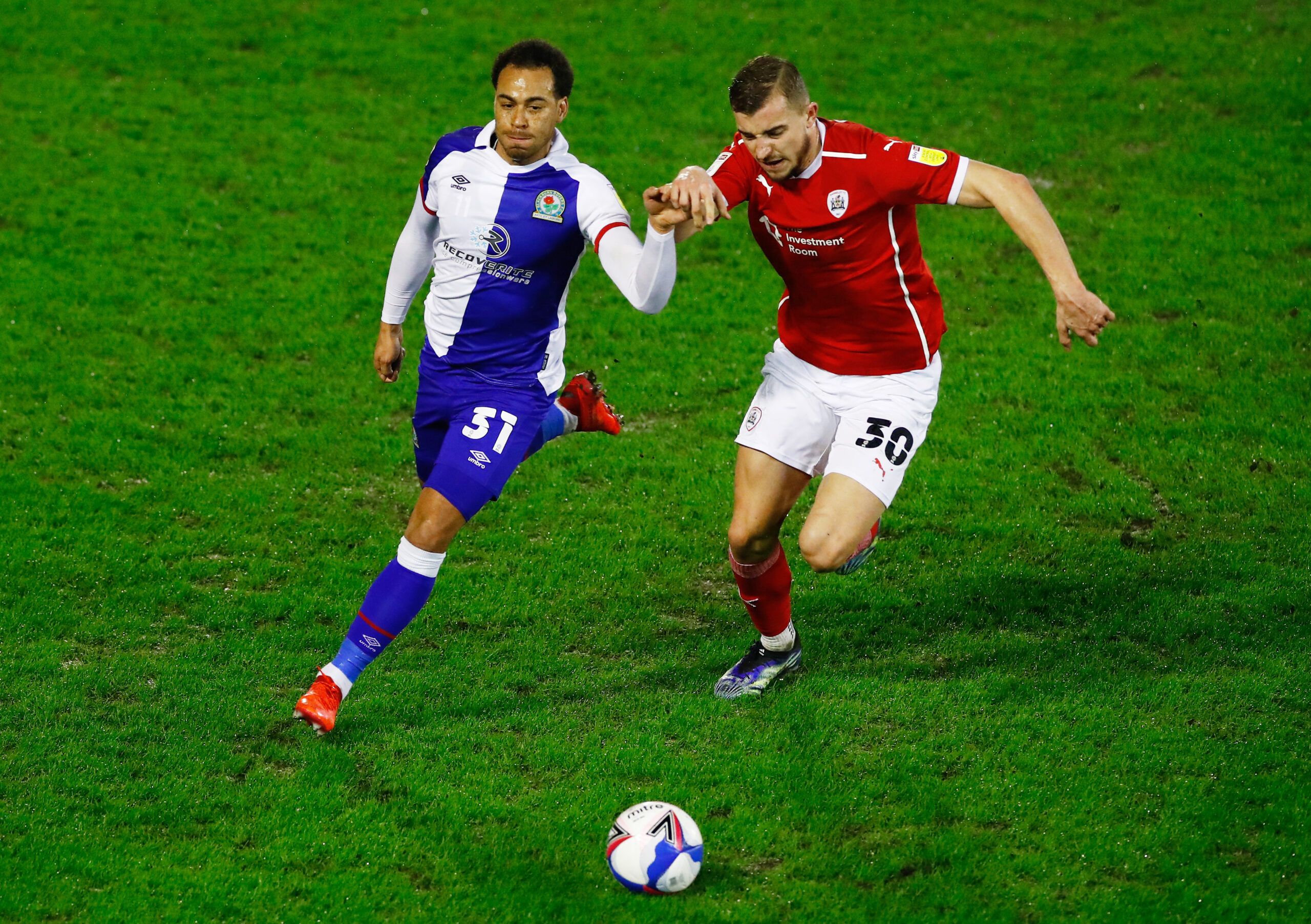 Soccer Football - Championship -  Barnsley v Blackburn Rovers - Oakwell, Barnsley, Britain - February 17, 2021  Blackburn Rovers' Elliott Bennett in action with Barnsley's Michal Helik Action Images/Jason Cairnduff EDITORIAL USE ONLY. No use with unauthorized audio, video, data, fixture lists, club/league logos or 'live' services. Online in-match use limited to 75 images, no video emulation. No use in betting, games or single club /league/player publications.  Please contact your account represe