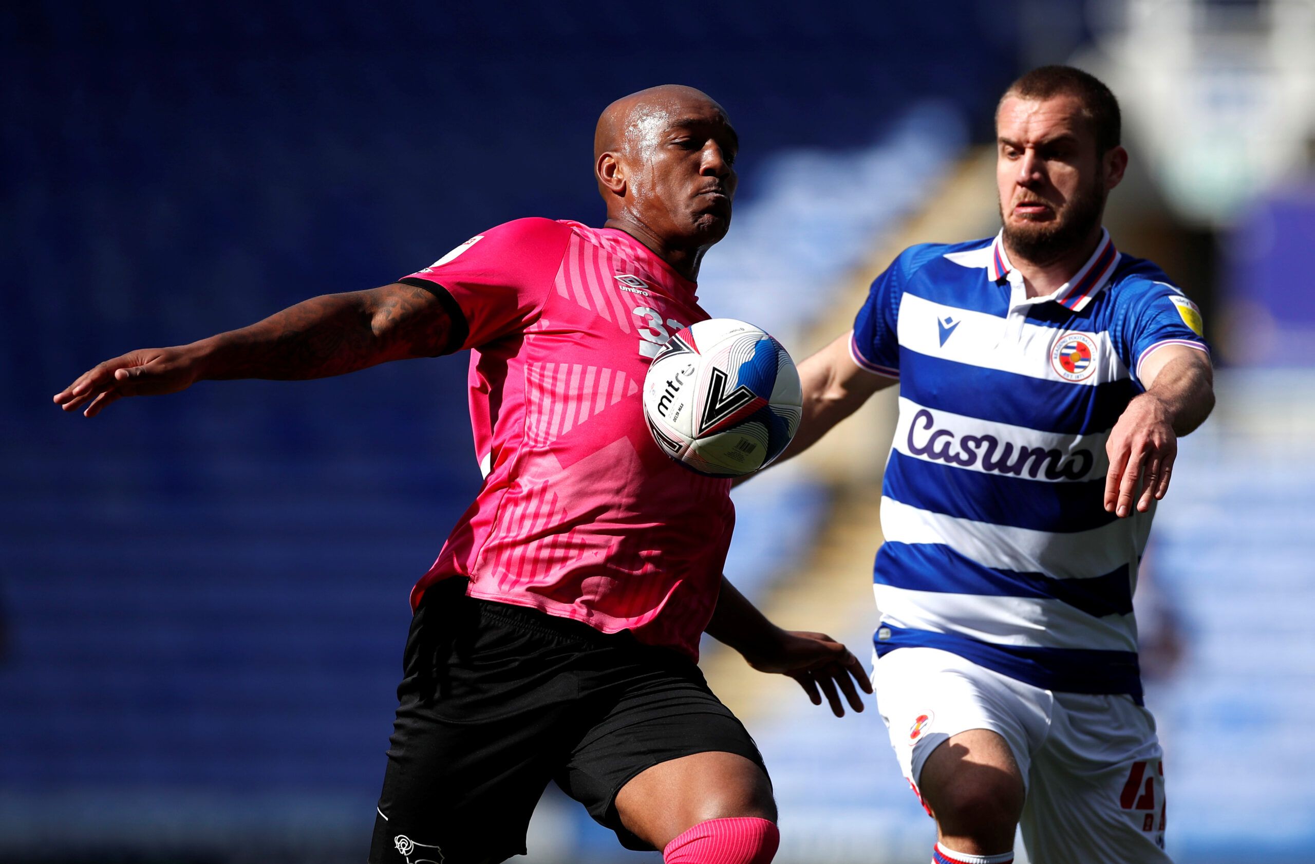 Soccer Football - Championship - Reading v Derby County - Madejski Stadium, Reading, Britain - April 5, 2021  Derby's Andre Wisdom and Reading's George Puscas in action  Action Images/Paul Childs  EDITORIAL USE ONLY. No use with unauthorized audio, video, data, fixture lists, club/league logos or 