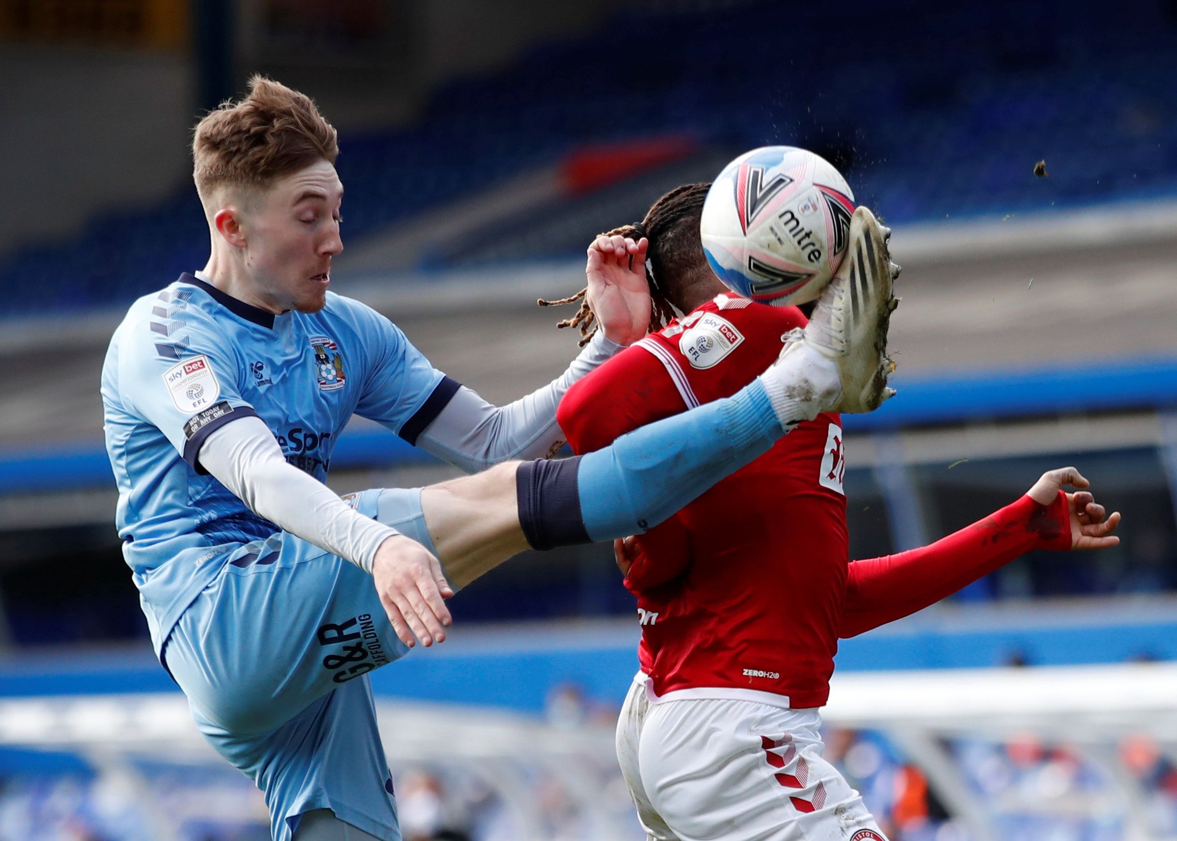 Soccer Football - Championship - Coventry City v Bristol City - St Andrew's, Birmingham, Britain - April 5, 2021  Coventry City's Josh Eccles in action with Bristol City's Kasey Palmer  Action Images/Andrew Boyers  EDITORIAL USE ONLY. No use with unauthorized audio, video, data, fixture lists, club/league logos or 