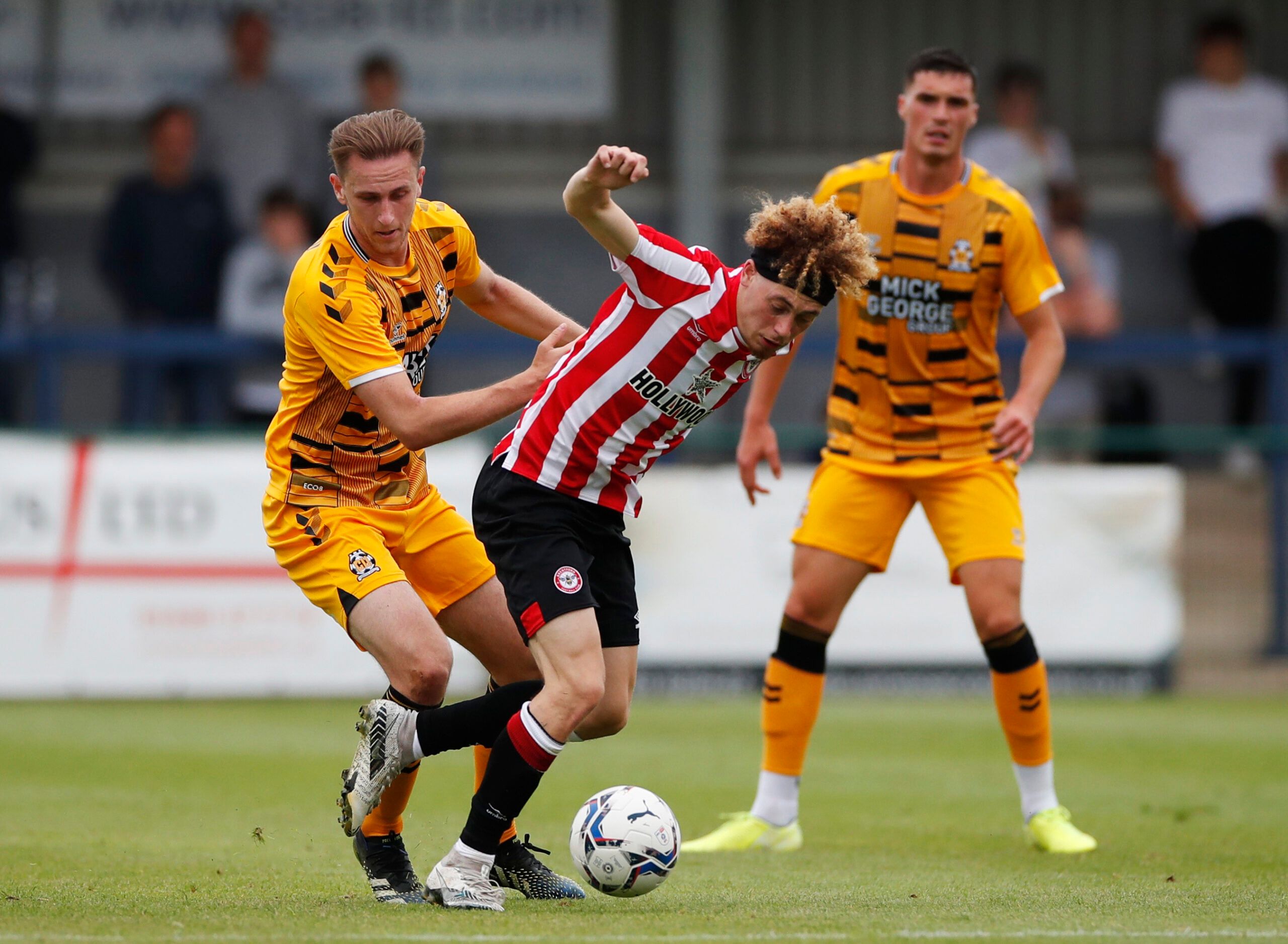 Soccer Football - Pre Season Friendly - Cambridge United v Brentford - Abbey Stadium, Cambridge, Britain - July 23, 2021  Brentford's Nathan Young-Coombes in action with Cambridge United's Adam May Action Images via Reuters/Paul Childs