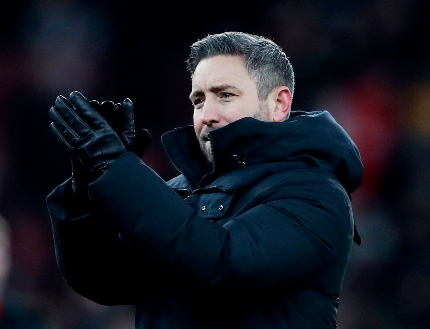 Soccer Football - Carabao Cup - Quarter Final - Arsenal v Sunderland - Emirates Stadium, London, Britain - December 21, 2021 Sunderland manager Lee Johnson applauds fans after the match Action Images via Reuters/Lee Smith EDITORIAL USE ONLY. No use with unauthorized audio, video, data, fixture lists, club/league logos or 'live' services. Online in-match use limited to 75 images, no video emulation. No use in betting, games or single club /league/player publications.  Please contact your account 