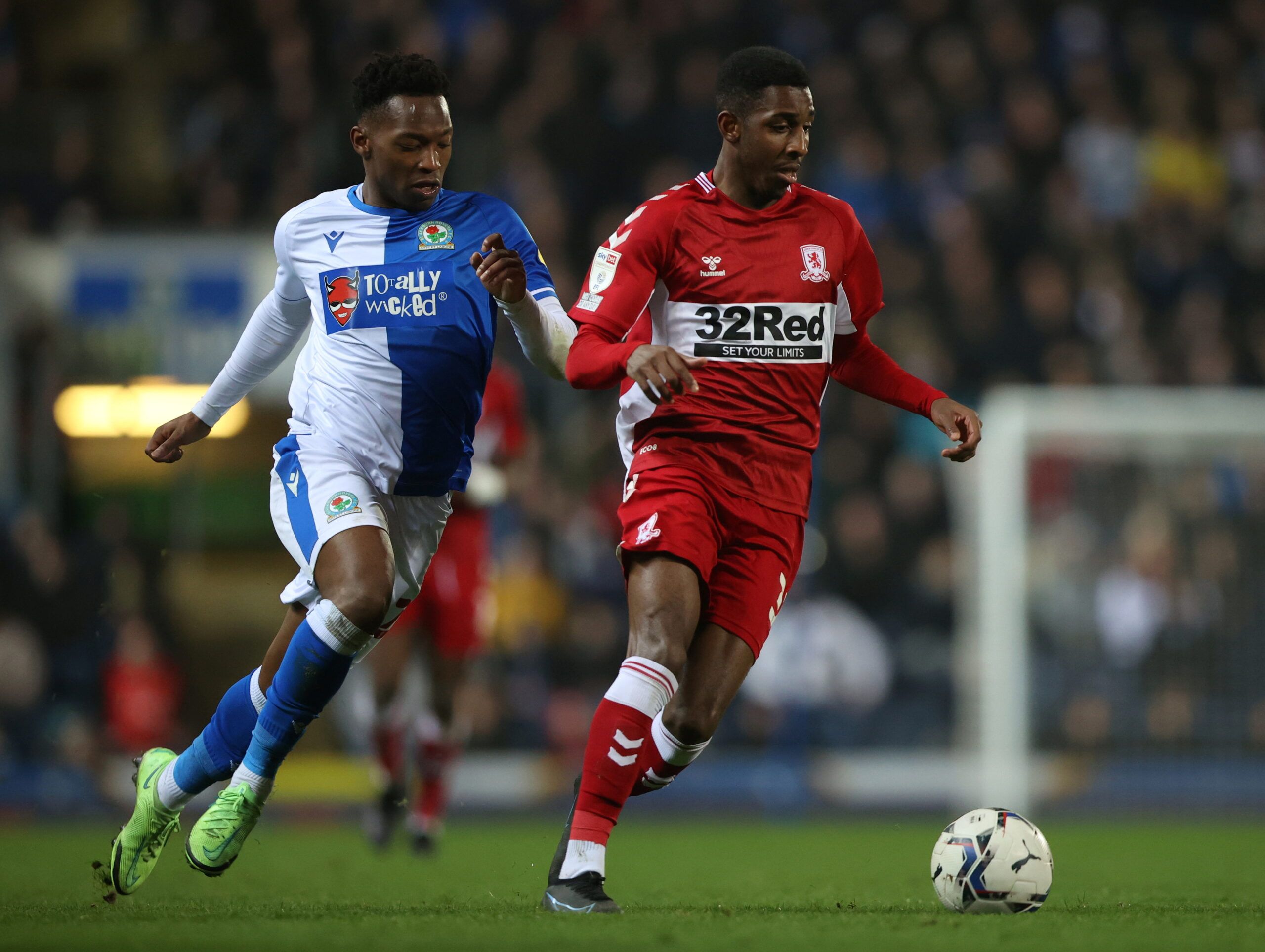 Soccer Football - Championship - Blackburn Rovers v Middlesbrough - Ewood Park, Blackburn, Britain - January 24, 2022  Middlesbrough's Isaiah Jones in action with Blackburn Rovers' Tayo Edun  Action Images/Molly Darlington  EDITORIAL USE ONLY. No use with unauthorized audio, video, data, fixture lists, club/league logos or 