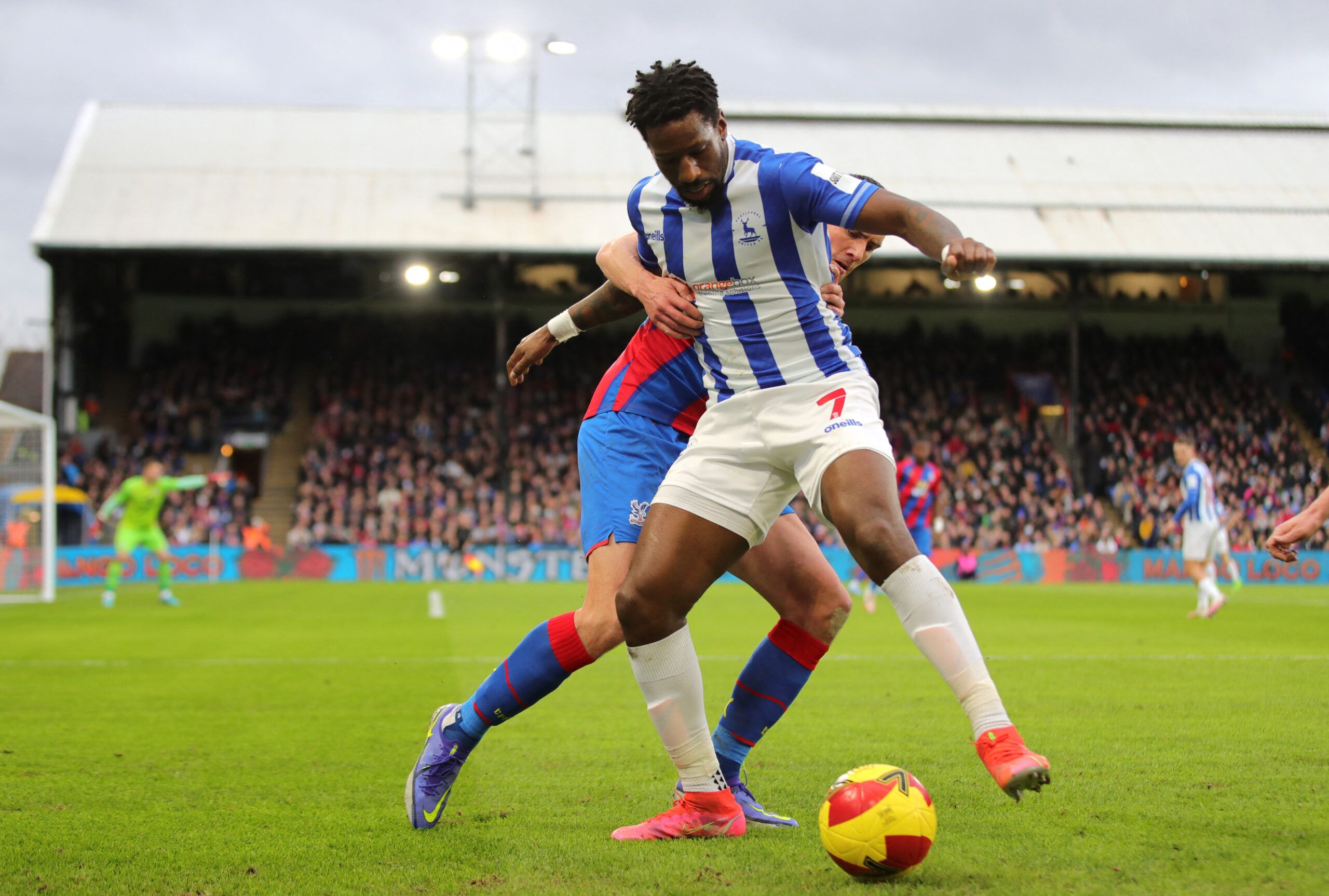 Soccer Football - FA Cup - Fourth Round - Crystal Palace v Hartlepool United - Selhurst Park, London, Britain - February 5, 2022 Hartlepool United's Omar Bogle in action with Crystal Palace's Martin Kelly REUTERS/Chris Radburn