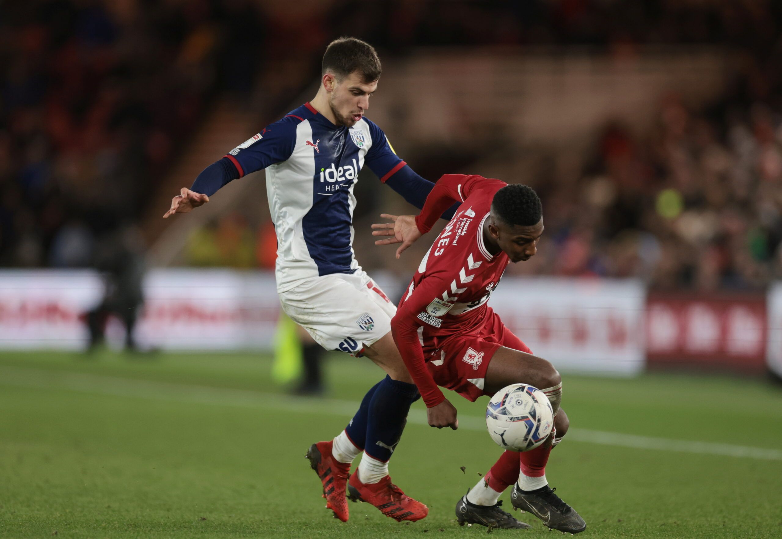 Soccer Football - Championship - Middlesbrough v West Bromwich Albion - Riverside Stadium, Middlesbrough, Britain - February 22, 2022  West Brom Albion?s Jayson Molumby in action with Middlesbrough?s Isaiah Jones Action Images/Lee Smith