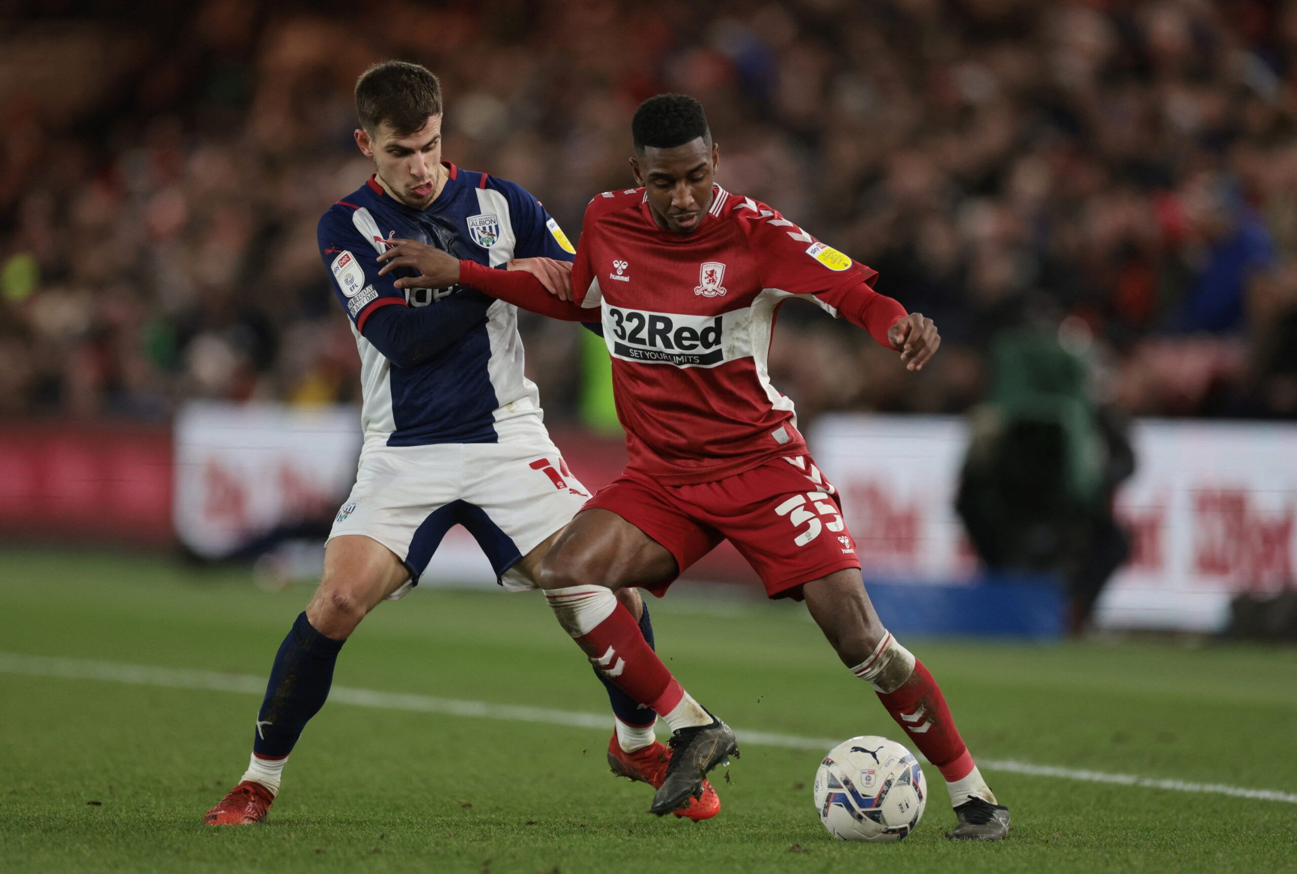 Soccer Football - Championship - Middlesbrough v West Bromwich Albion - Riverside Stadium, Middlesbrough, Britain - February 22, 2022  West Brom Albion?s Jayson Molumby in action with Middlesbrough?s Isaiah Jones Action Images/Lee Smith