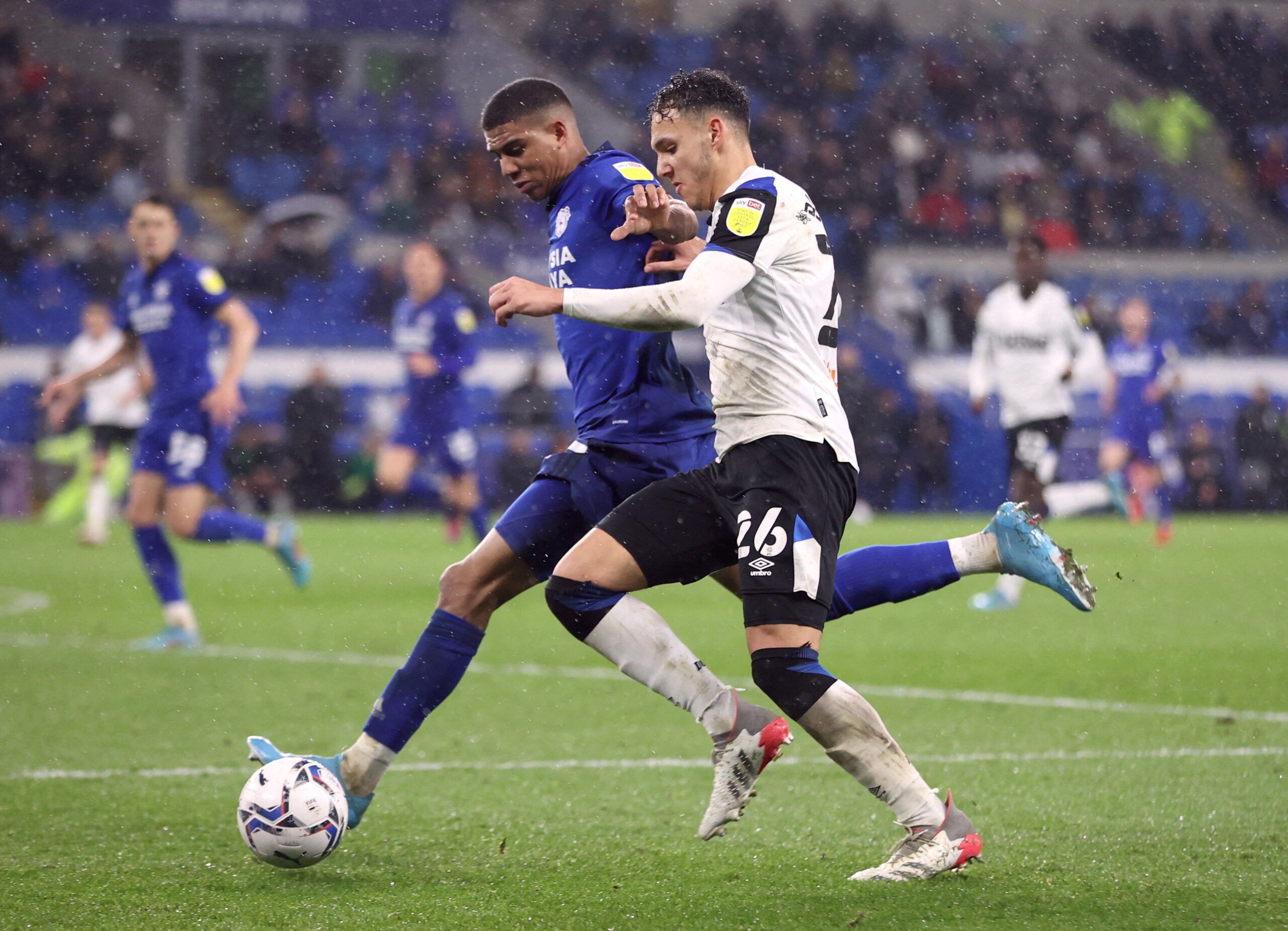 Soccer Football - Championship - Cardiff City v Derby County - Cardiff City Stadium, Cardiff, Britain - March 1, 2022  Derby County's Lee Buchanan in action with Cardiff City's Cody Drameh  Action Images/Molly Darlington  EDITORIAL USE ONLY. No use with unauthorized audio, video, data, fixture lists, club/league logos or 