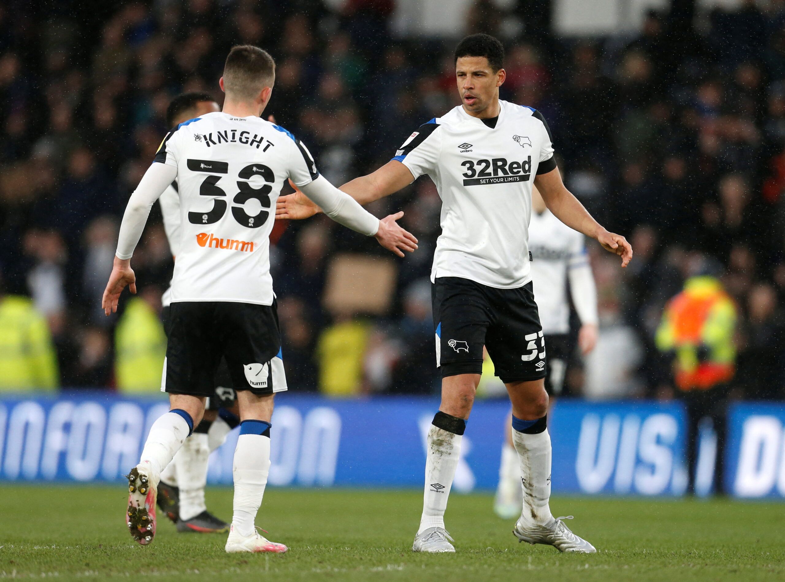 Soccer Football - Championship - Derby County v Barnsley - Pride Park, Derby, Britain - March 5, 2022  Derby County's Curtis Davies and Jason Knight celebrate after the match  Action Images/Ed Sykes  EDITORIAL USE ONLY. No use with unauthorized audio, video, data, fixture lists, club/league logos or 